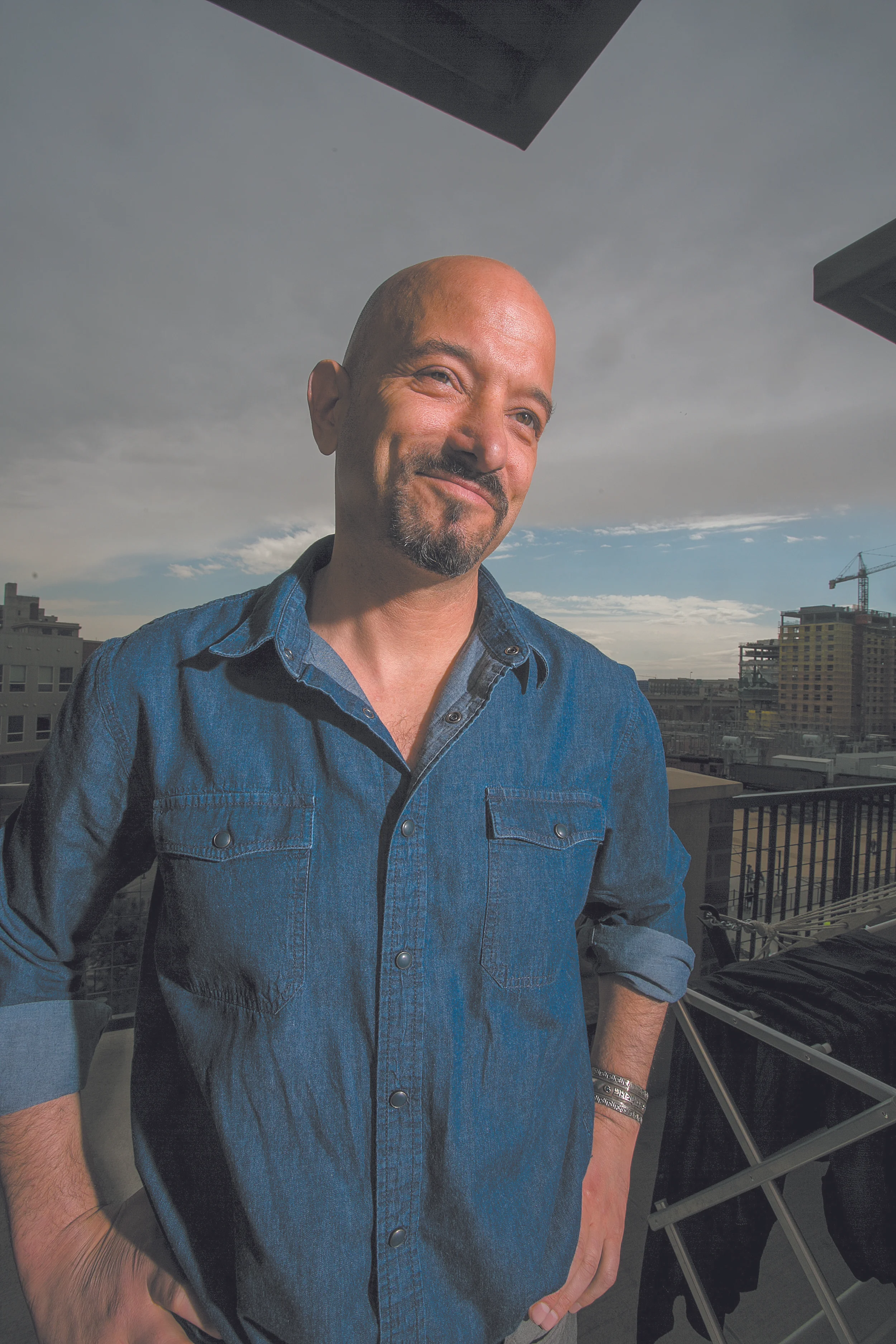 Jason Flores-Williams is representing Denver’s homeless in a class action suit against the city of Denver over the illegal search and seizure of property during homeless sweeps to enforce the camping ban. Flores-Williams said he has personally spent nearly $70,000 since 2016 to see the case through. (Credit: Giles Clasen)