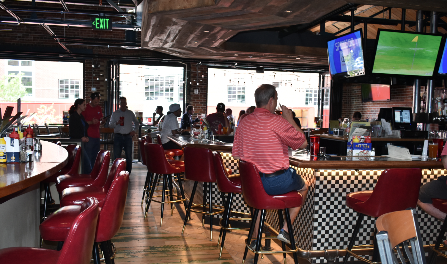 The bar area in the Cherry Cricket’s recently-opened second location. The restaurant opened in the old home of Breck on Blake next to Coors Field. (Credit: Sarah Ford)