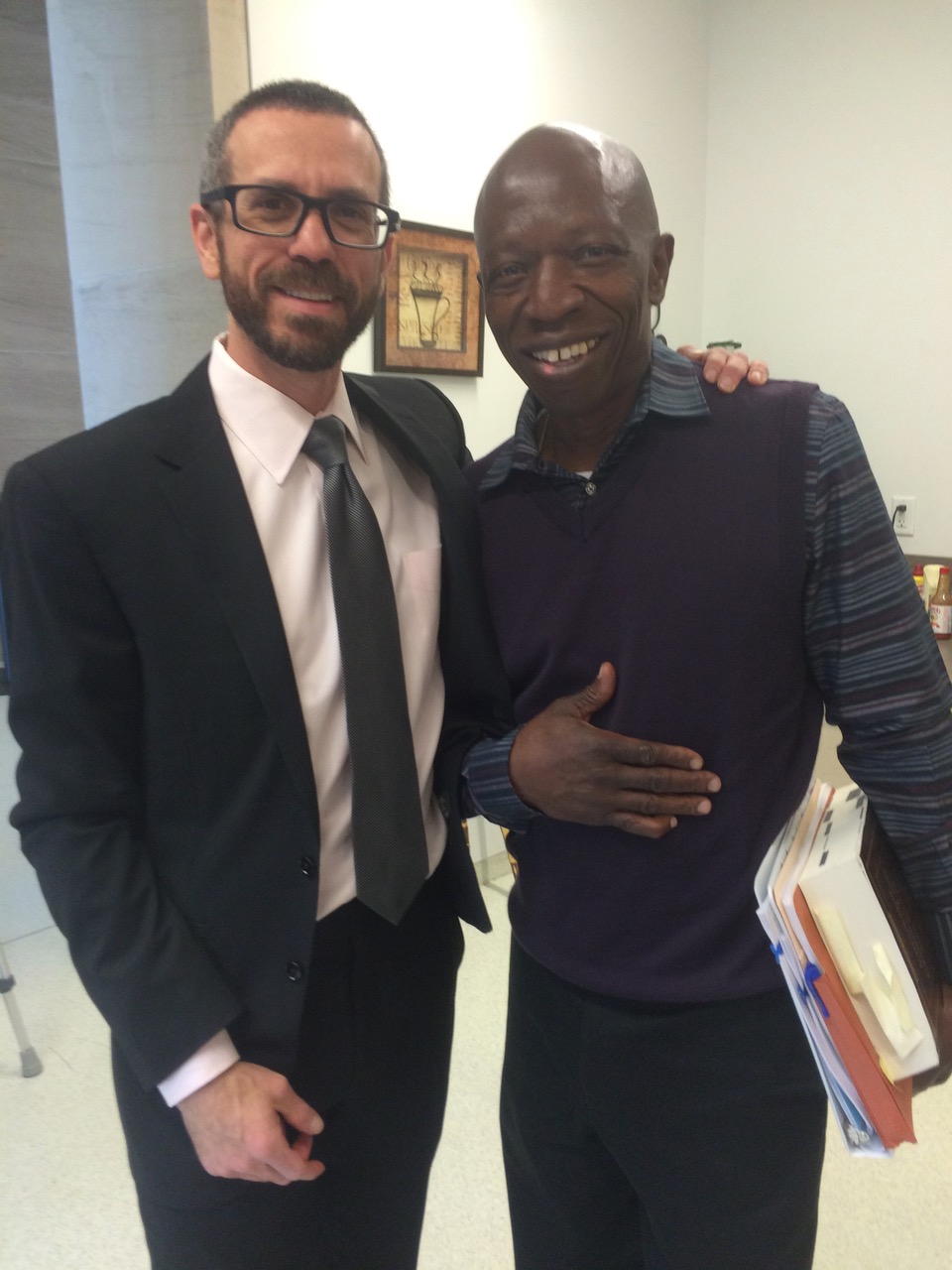 Attorney Eric Klein stands with Clarence Moses-El after a status hearing in Denver’s courthouse. (Credit: Eric Klein)