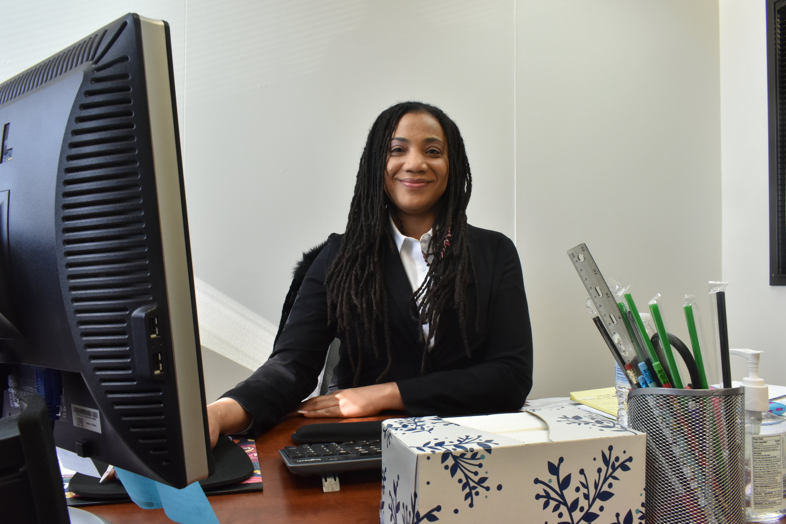 DeTonia Gooden in her office at Advanced Safety Consulting. Gooden started working with the company after graduating from the WorkNow program in July 2018. (Credit: Sarah Ford)