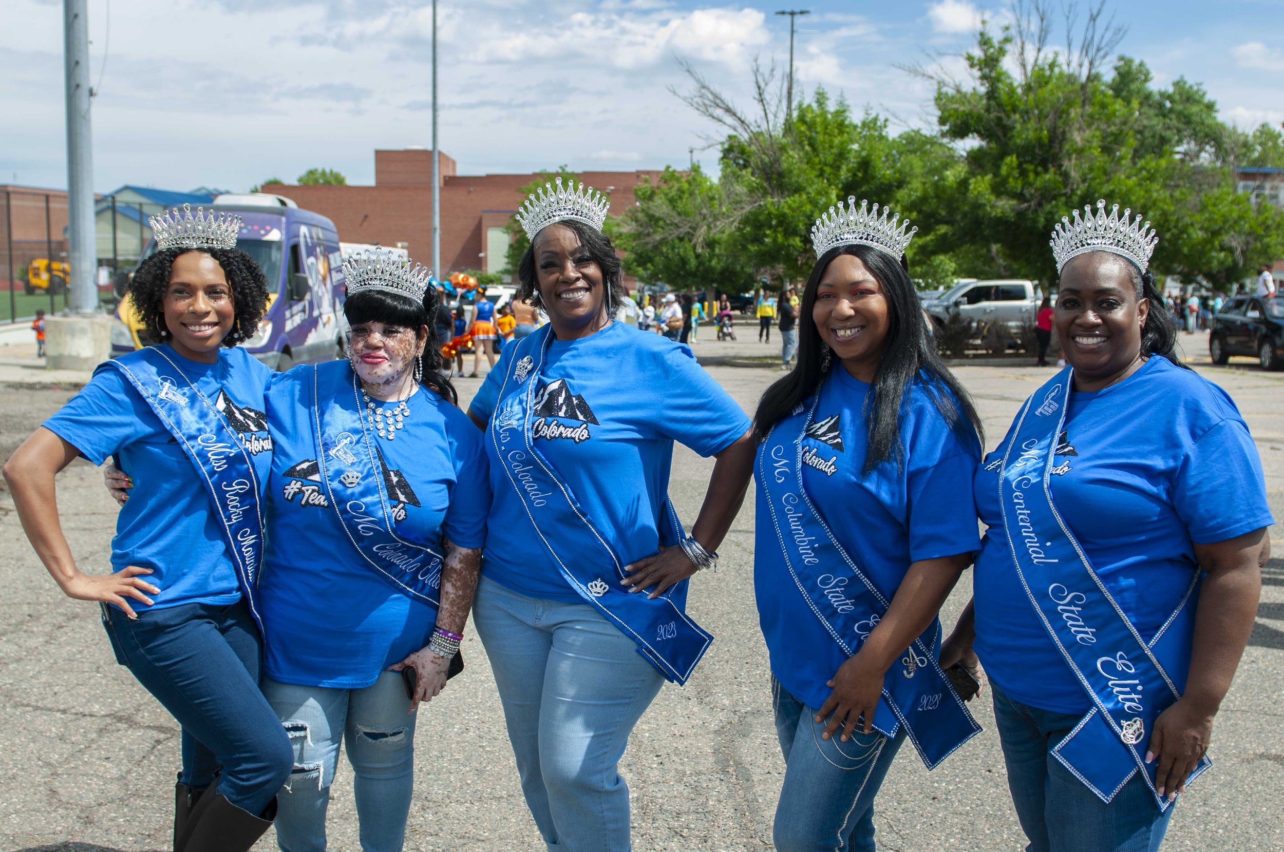    Ladies of the Colorado All World Queens pose for a photo before the start of the Juneteenth parade   