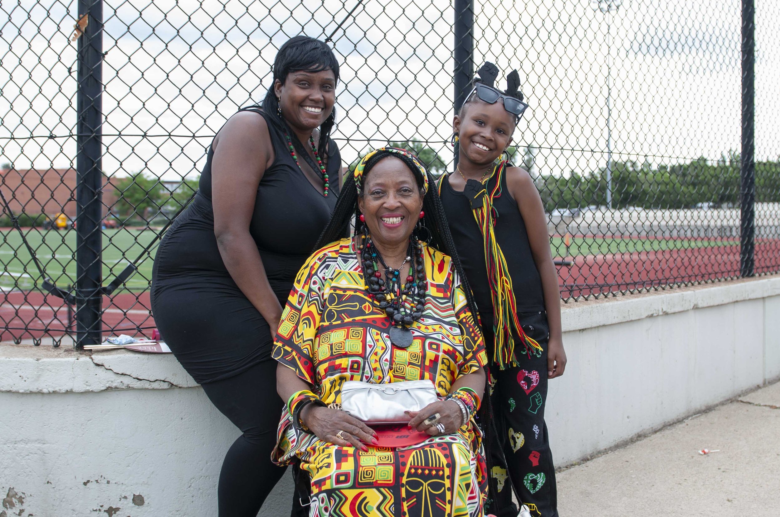    Danielle Davis (left), her daughter Danalynn Davis (right), and Annie Lewis (center), pose for a photo during the Juneteeth parade.&nbsp;   