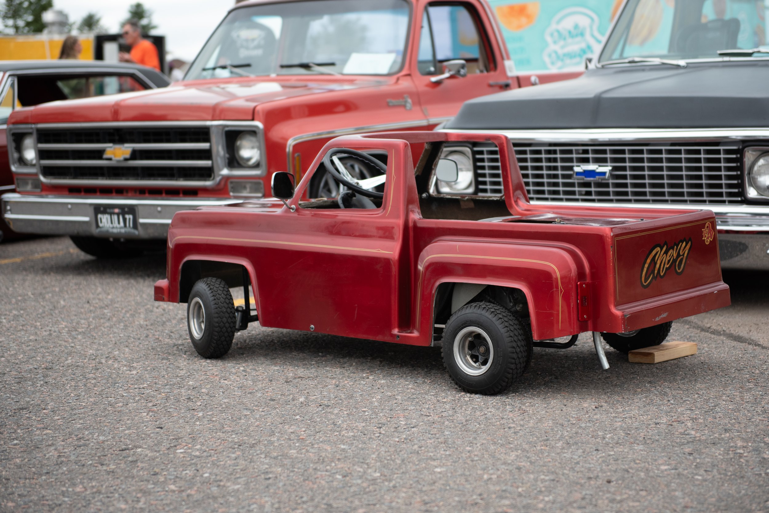 Photo: Adrian Michael  A miniture Chevy Bonanzo toy truck is parked next to a full sized 1976 Chevy Bonanzo truck. 