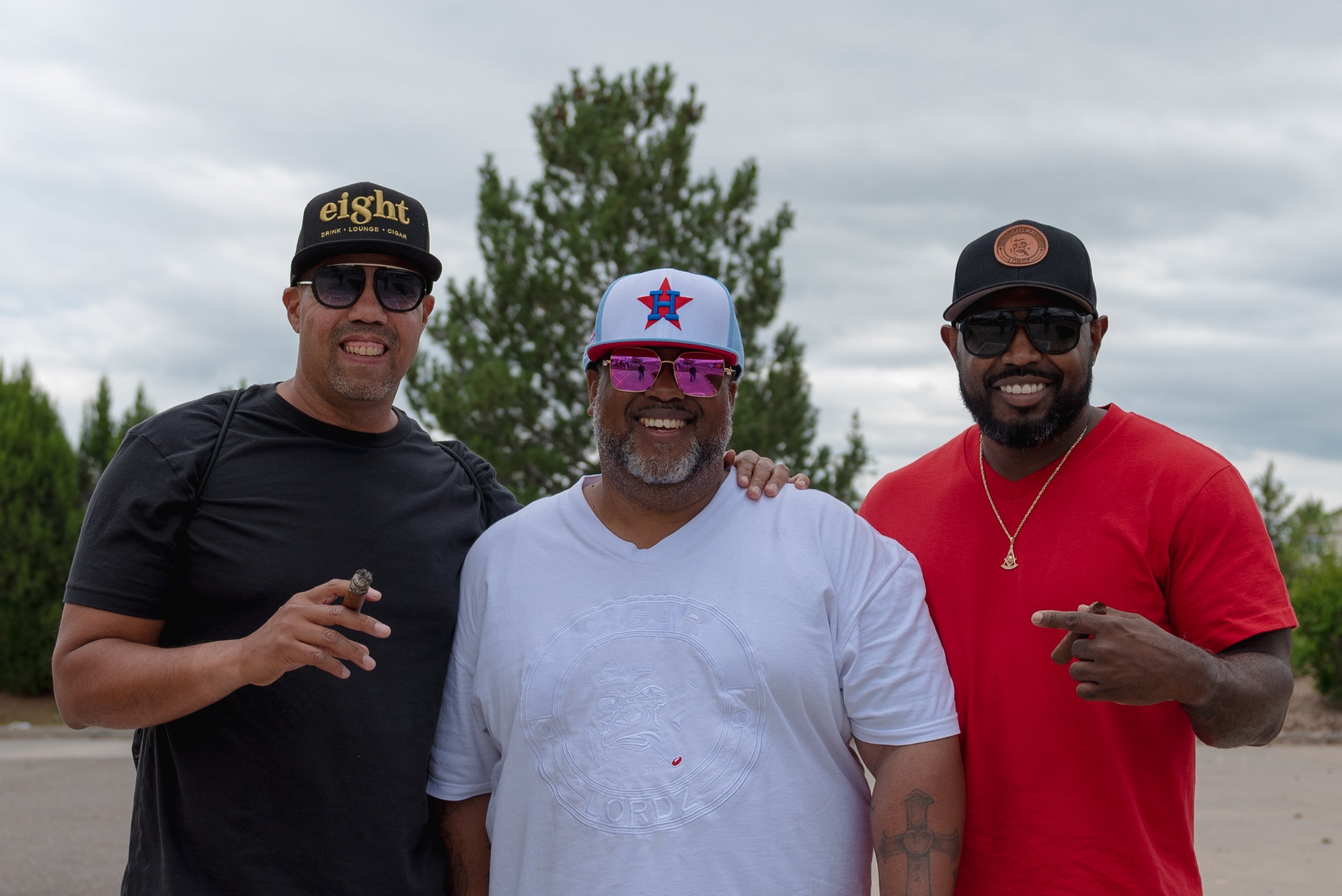  Photo: Adrian Michael  CJ Johnson, President of Cigar Lordz (middle) poses with other members of the Cigar Lordz. 