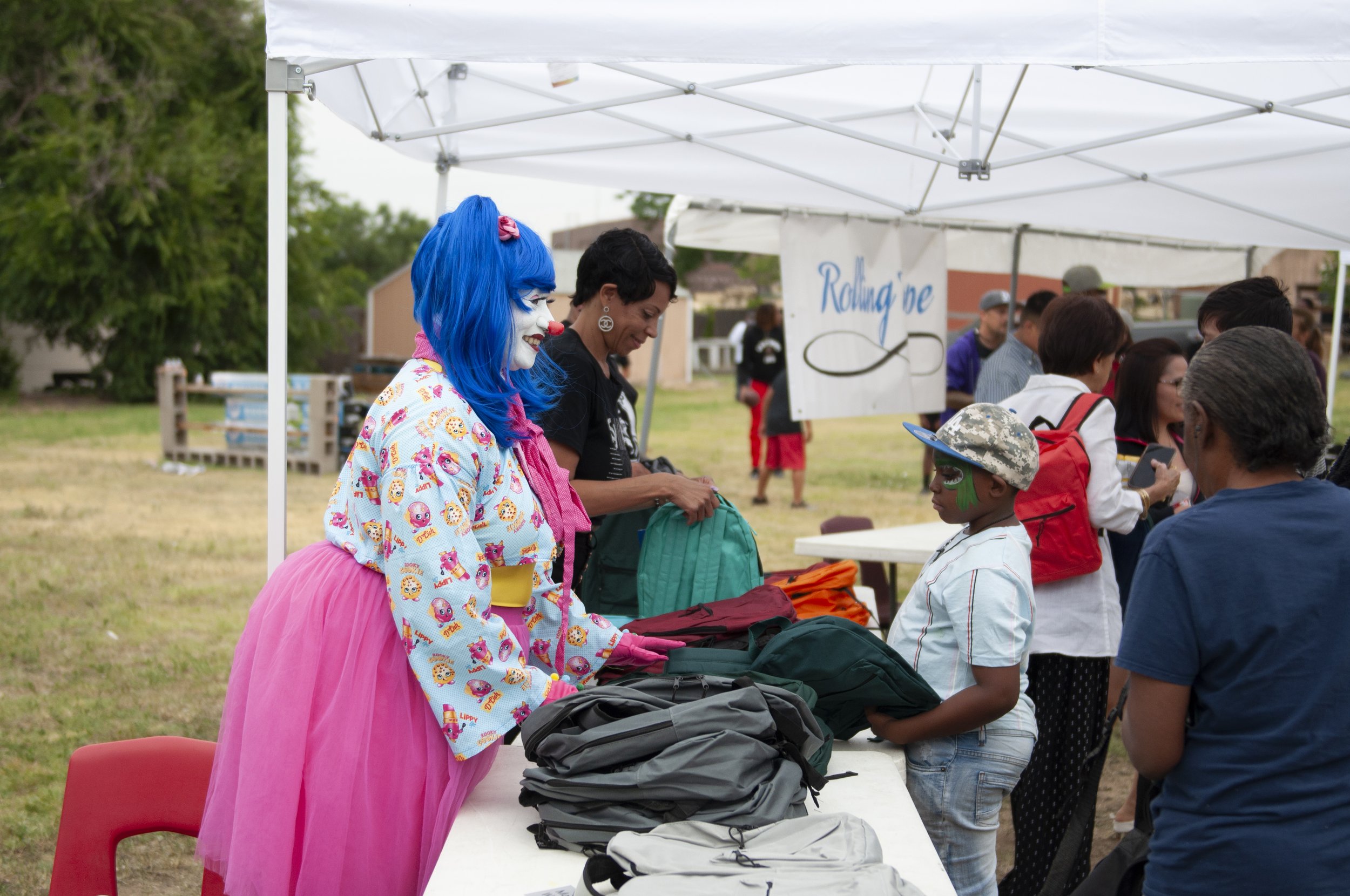  BlahAwesome hands out backpacks while greeting attendees. Photo: Adrian Michael 