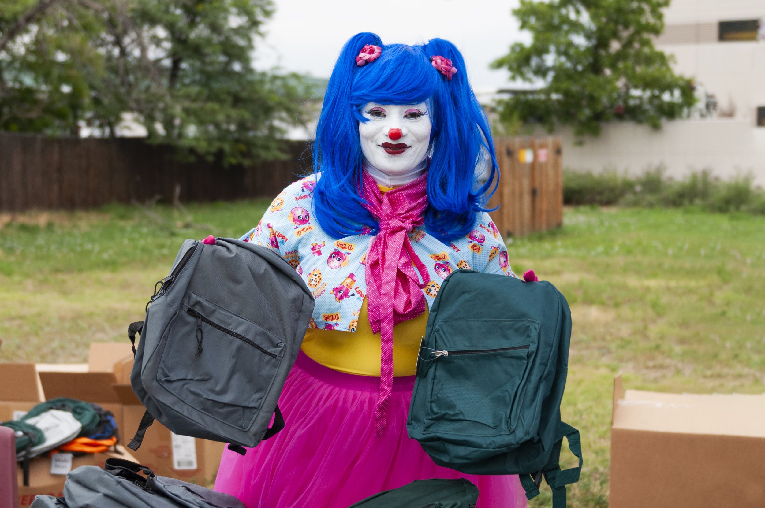  BlahAwesome shows off  backpacks during the sixth annual Aurora Day backpack giveaway. Photo: Adrian Michael 