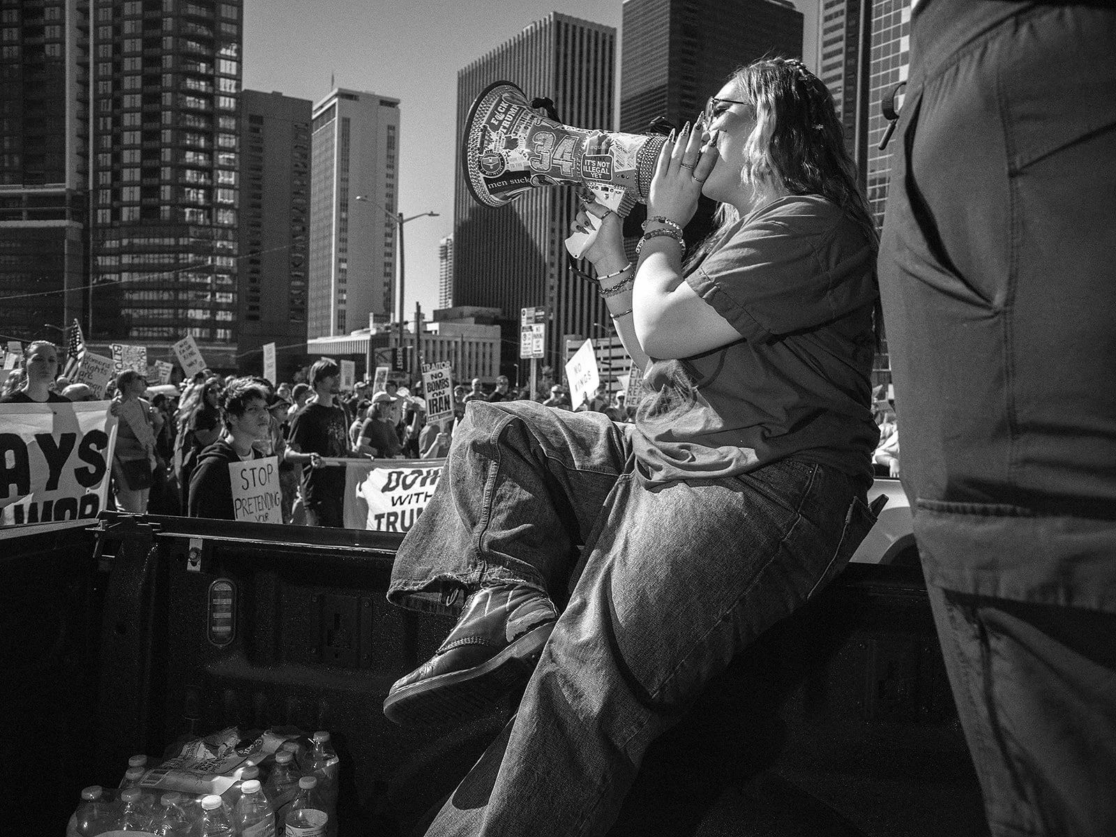 Organizers use a pickup truck as a mobile stage on Saturday, Oct. 17, 2026. Photo by Jeff Tidwell for the Denver Voice.