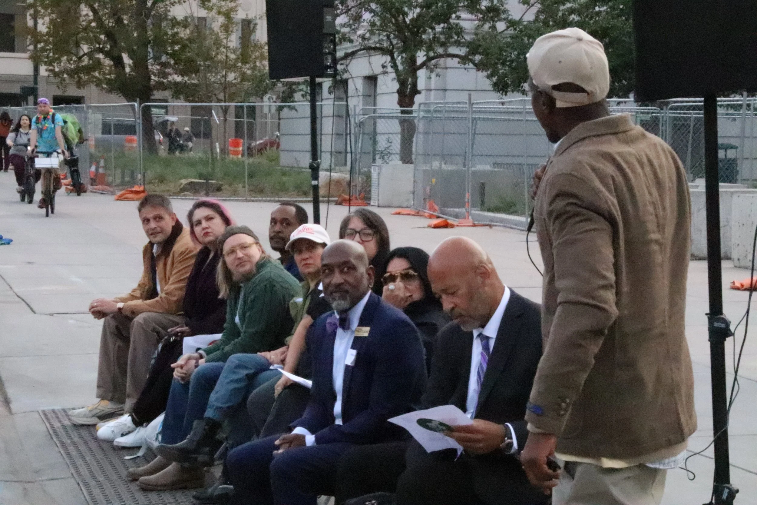 At-large city council candidates speak with unhoused community in outdoor forum