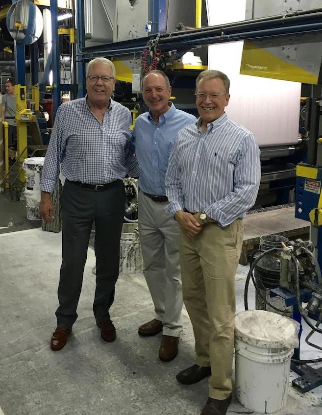 is on the floor of Len-Tex Wall-covering Manufacturing in North Walpole with Don and Charlie Lennon, owners of Len-Tex.