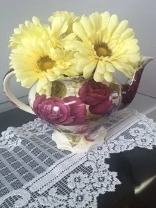 A cute little teapot used for a flower display.