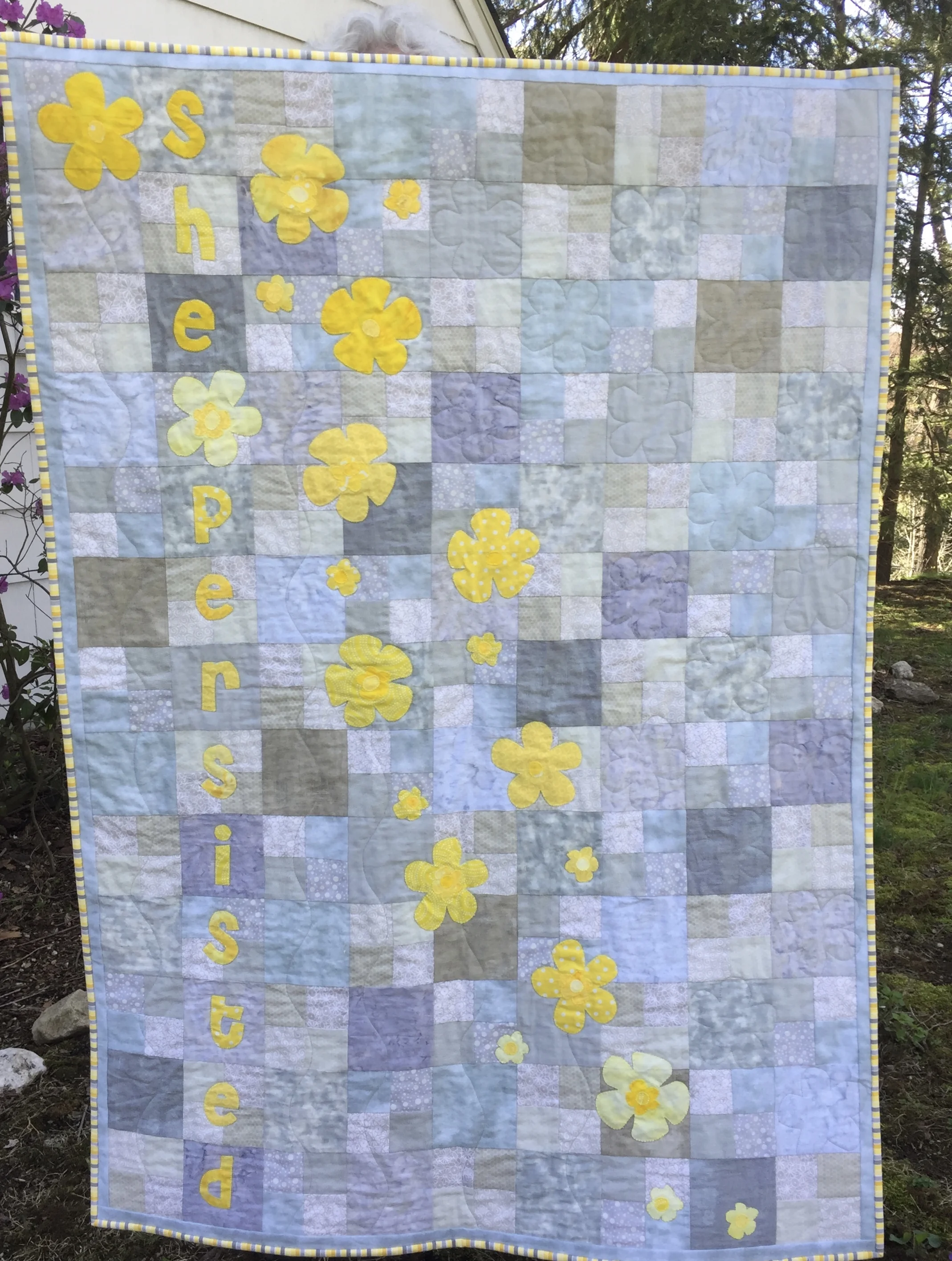 Blanket Statement is inspired by Hillary Clinton's line, "Bloom where you are planted." This crib quilt was auctioned off to raise money for local community gardens in Chappaqua NY. Pattern coming soon! Make one for your future feminist!