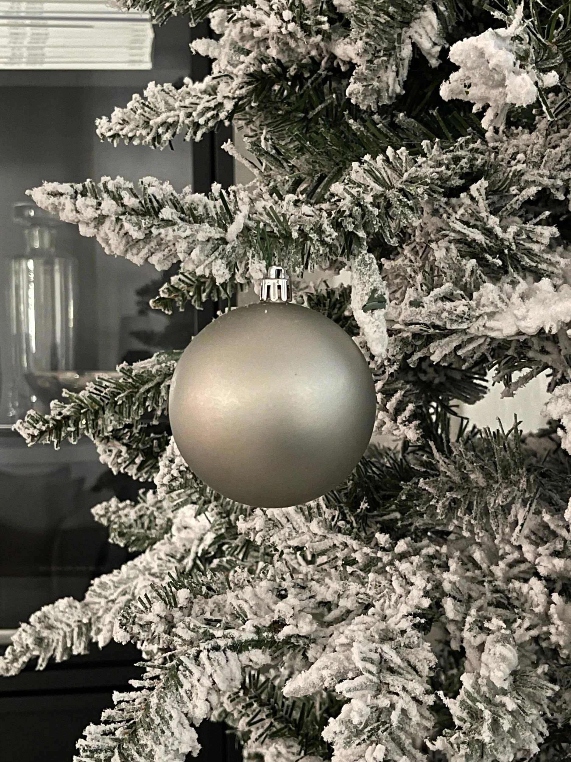 Matte Limestone Ball Ornament on Flocked Tree