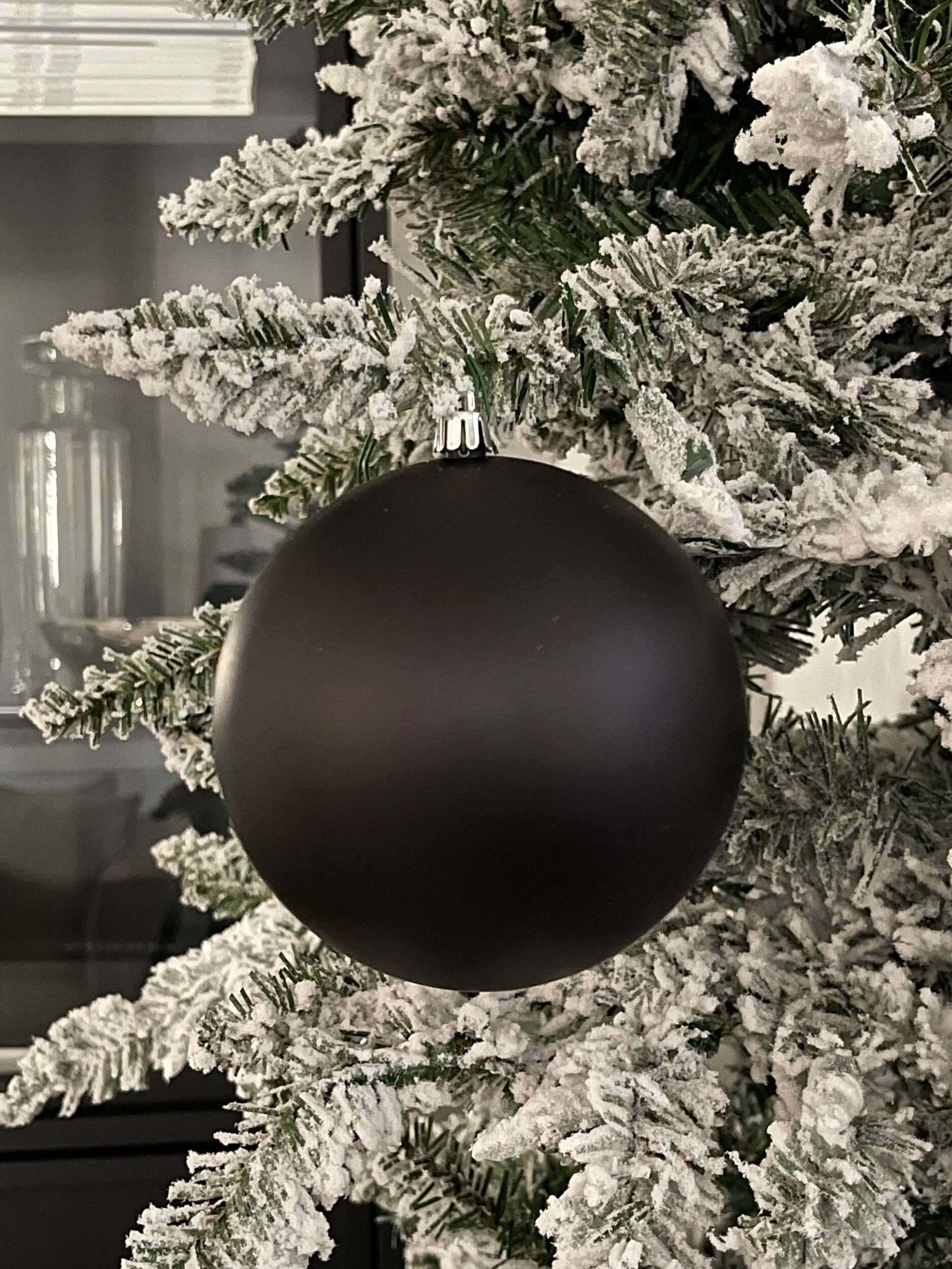 Modern Matte Black Ball Ornament on Flocked Tree