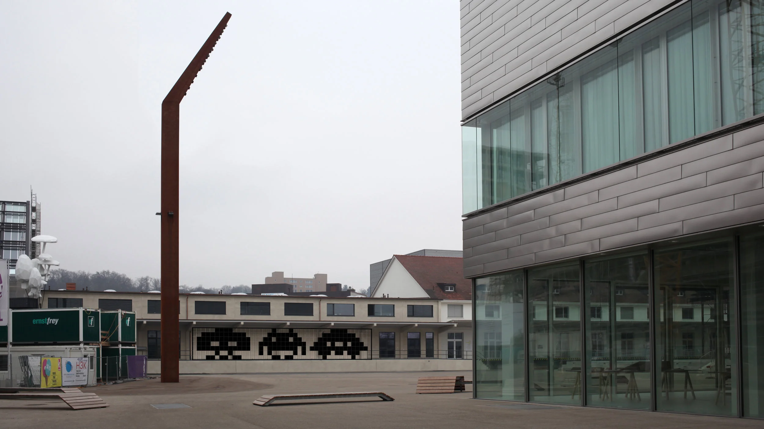 View from Freilager-Platz tram station. The inconspicuous HeK facade is central to the evolving master plan for an arts and culture hub for Basel.