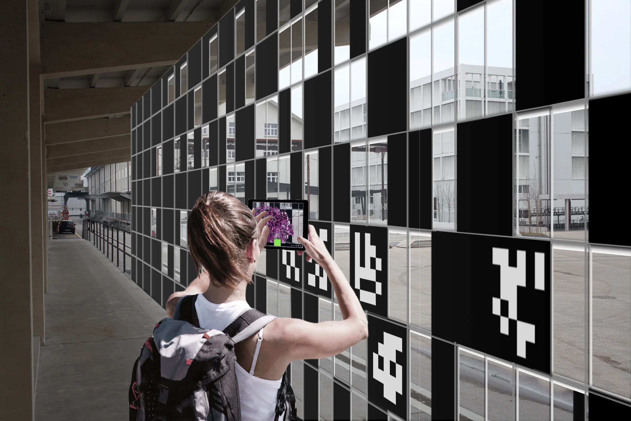 Behind the installation visitors can interact with small-scale fiducial markers to explore a gallery of AR content