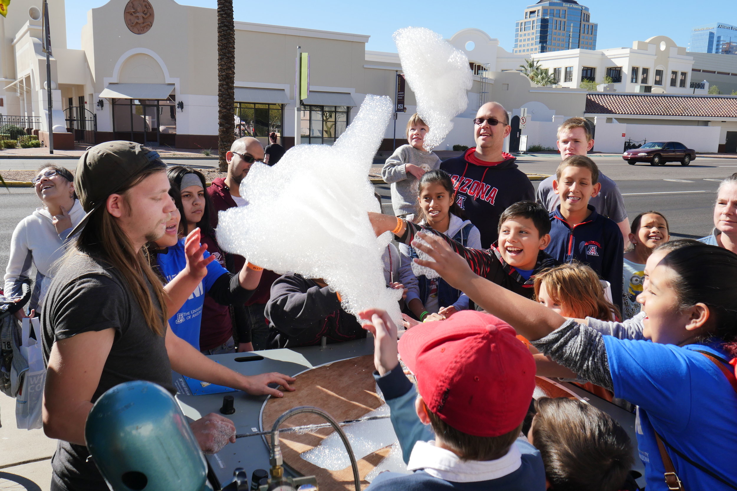 A group of students try to touch helium-filled bubbles as they float away into the sky during Connect2STEM on January 29, 2017 in Phoenix, Ariz. (Nicholas Serpa/DD).