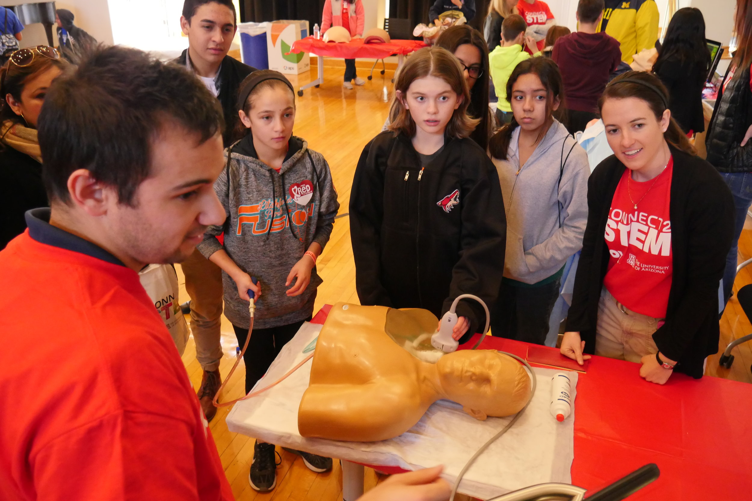 A group of kids get their hands on ultrasound technology in an interactive biotechnology demonstration. (Nicholas Serpa/DD)