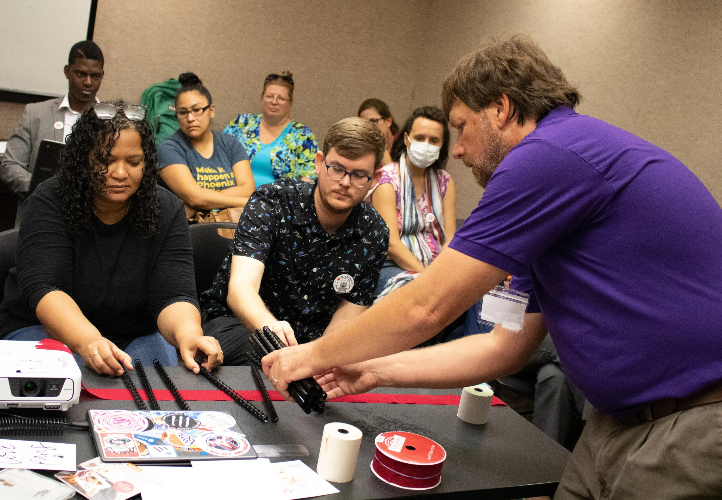 Al Pajak, a professional development facilitator with Treasures 4 Teachers, demonstrates how everyday objects can be used in STEM lessons during the 2019 Arizona STEM &amp; Innovation Summit. (Photo by Nick Serpa, Chamber Business News)