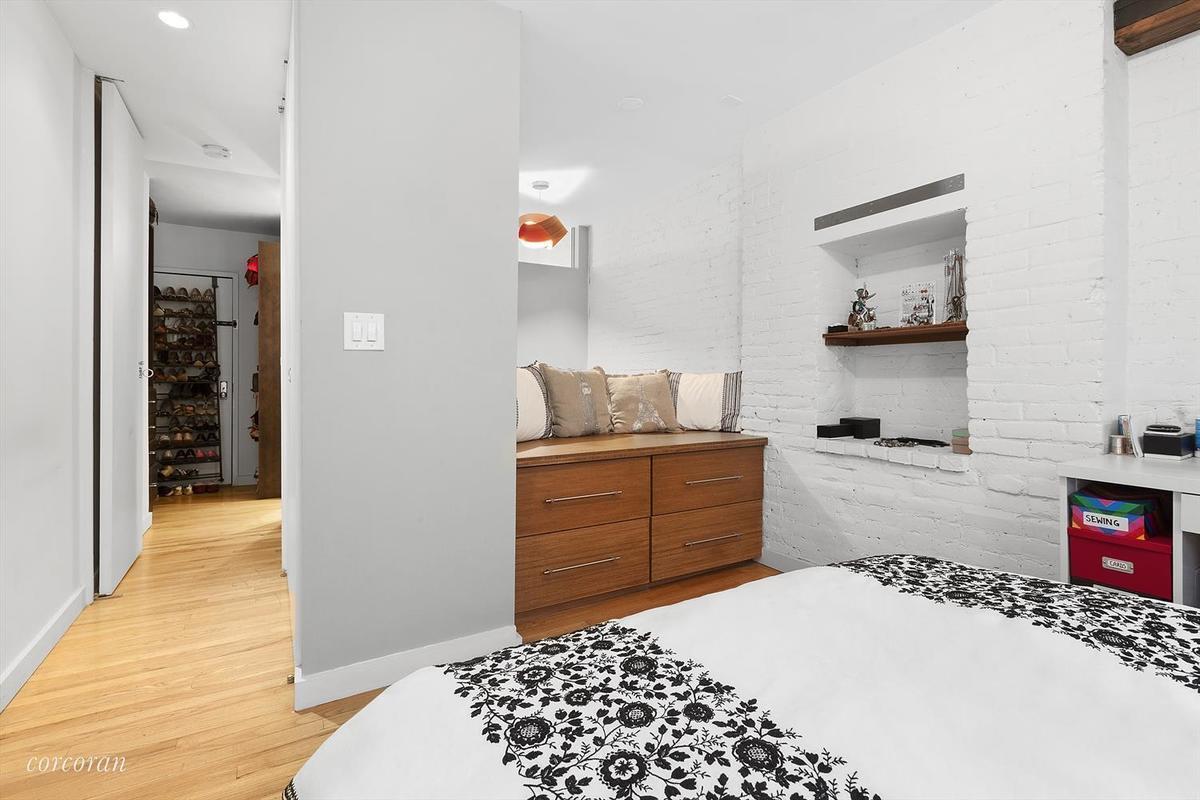 Live large at 118 Suffolk #2A , a loft-like one bedroom duplex featuring exposed brick, renovated kitchen & bath, and thoughtful custom closets providing for clothing storage for all seasons! Be in the middle of the Essex Crossing re-development where you won't sacrifice space for your budget. Just one flight up, the apartment has western exposure from both levels, with double-paned windows for pin-drop quiet living & sleeping. Enter the main living area to a kitchen with custom cabinetry, Pietra Cardosa stone countertops, Miele, Fisher Paykel, & Liebherr fridge appliances and Grohe fixtures. The open layout is excellent for entertaining. On the upper level there is a sitting/reading area, bedroom and landing with floor-to-ceiling closets and shelving. The bathroom features a soaking tub, a Duravit sink and toilet, Grohe fixtures, and a backsplash of tumbled Carrera marble. The 13 unit boutique co-op allows cats & dogs and has a reasonable sublet policy (3 out of 5) as well as sound building financials & is professionally managed. The building recently updated the entry way and is a quiet get-away from the bustling Lower East Side.
