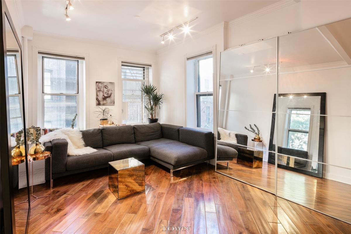 Make your home in this bright and airy one-bedroom featuring great finishes and light in the perfect SoHo location. Delightfully unexpected details are the hallmark of this charming home. In the spacious living room, you'll find treetop views and gorgeous wide-plank flooring set on the diagonal to add interest. High ceilings rise overhead and three large windows facing north and west bathe the space in light. The recently renovated open kitchen stylishly maximizes space with lovely tilework and a substantial granite island surrounding ample cabinetry and upscale stainless steel appliances, including a dishwasher. The serene bedroom and updated bathroom are set at the rear of the home, where a rustic door adds to the home's designer appeal, while two oversized closets provide abundant storage space in the living room. 131 Thompson Street is a boutique, elevator, co-op building offering low monthly charges and basement storage. Pets allowed (one per unit). Sublet policy: Shareholder must occupy apartment for two years, then can rent for two years with board approval. After the two-year period, the owner must move back into the apartment. Set on a lovely tree-lined stretch of Thompson Street, the block offers the conveniences of modern-day SoHo in a setting that recalls a friendly, old-school New York neighborhood. Small businesses, shops and restaurants line the nearby streets while the attractions of Greenwich Village, Hudson Square and Tribeca are mere moments away. Transportation couldn't be better with C/E, 1, N/R/W, B/D/F/M and 6 trains all nearby.