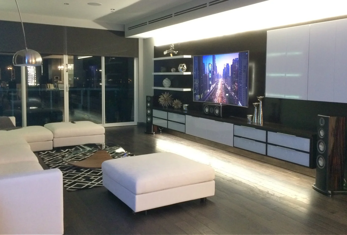 At Night this modern family room comes alive with led accent lighting and the sound of its Monitor Audio Platinum Series Home Theatre