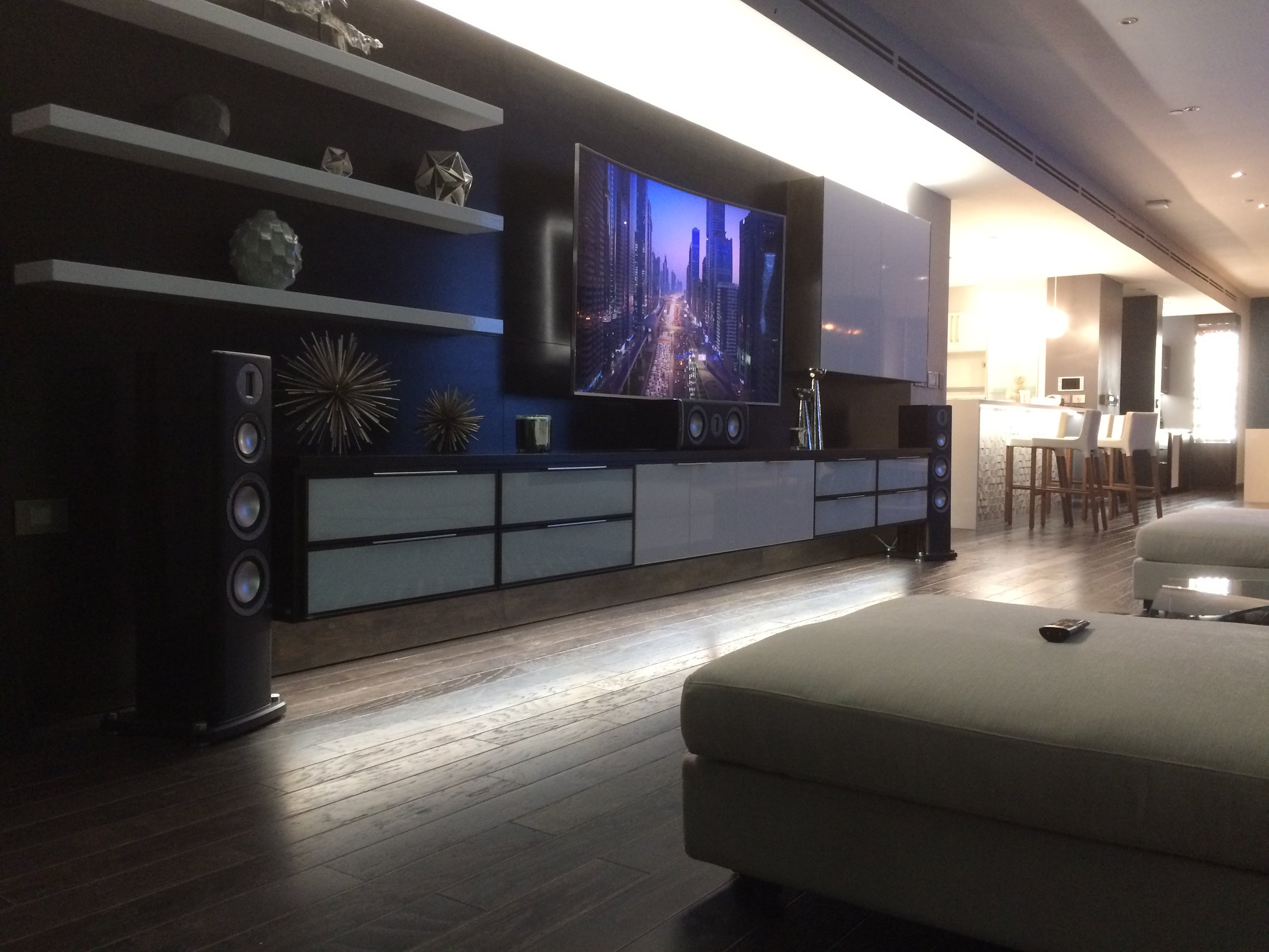  At Night this modern family room comes alive with led accent lighting and the sound of its Monitor Audio Platinum Series Home Theatre 
