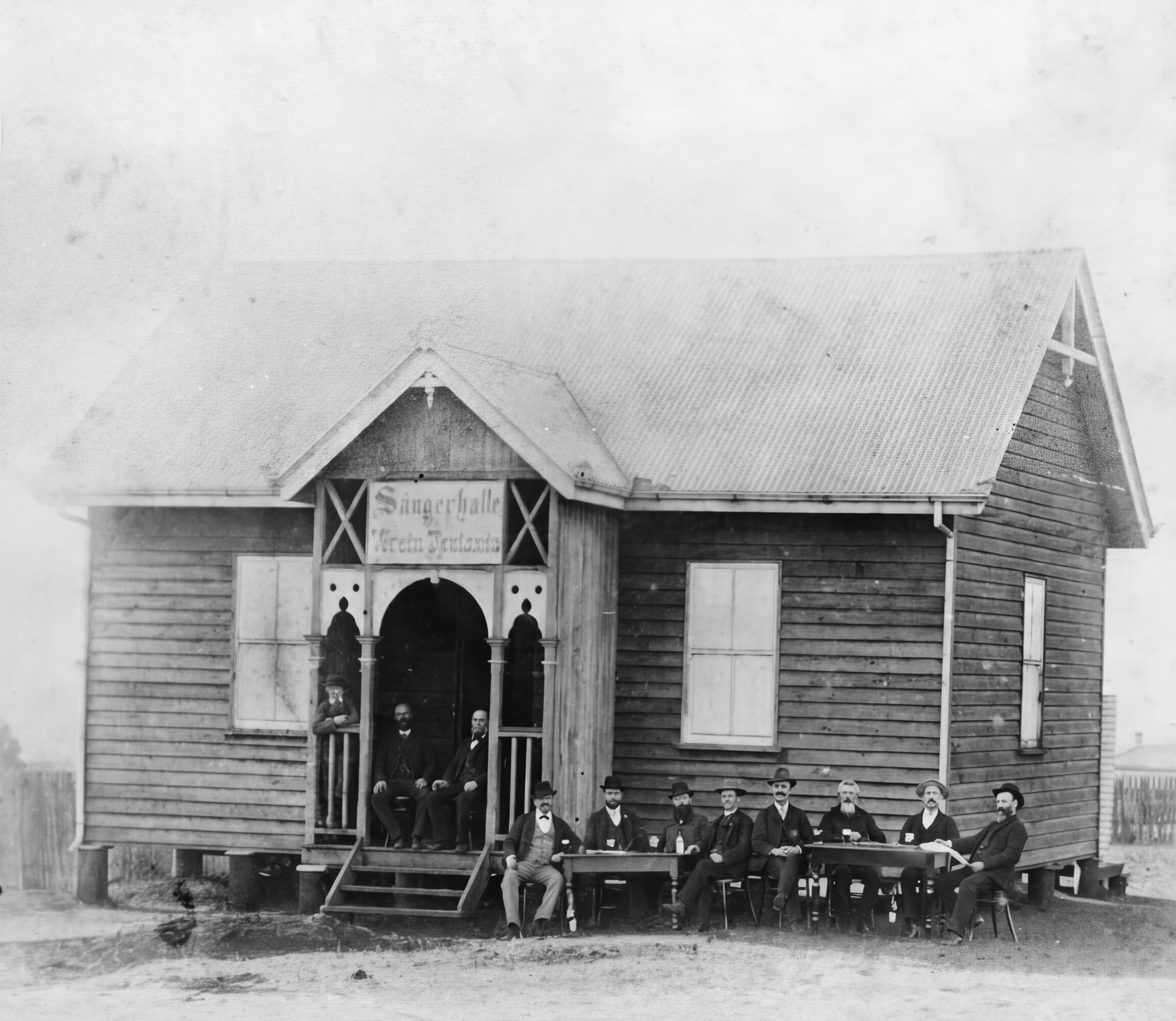  Gentlemen seated around tables outside the German Club Toowoomba, Qld, c.1896 | State Library of Queensland, John Oxley Library 