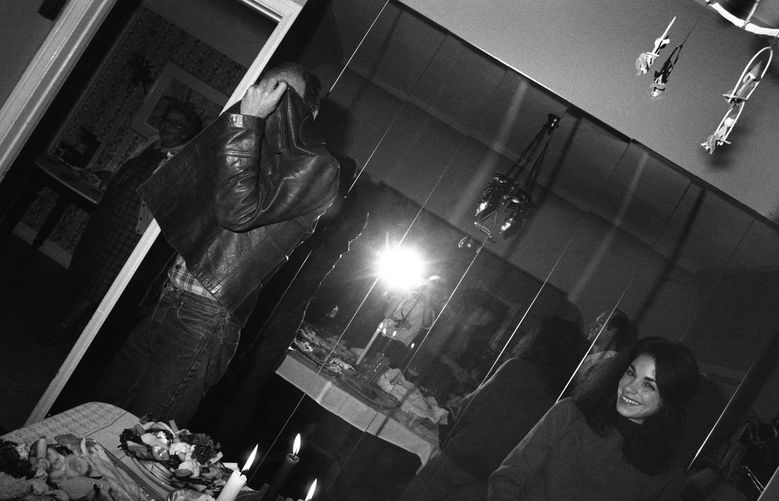 Los Angeles, December, 1981. Left to right: Sophie Youdelman, Randall Mason, Douglas Oliver (reflected in mirror), unknown woman.