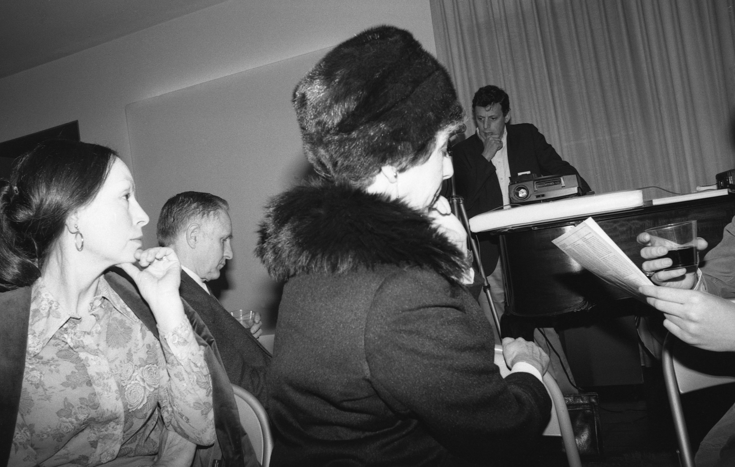 Philip Glass making a presentation at salon given by Betty Freeman, Los Angeles, 1981.