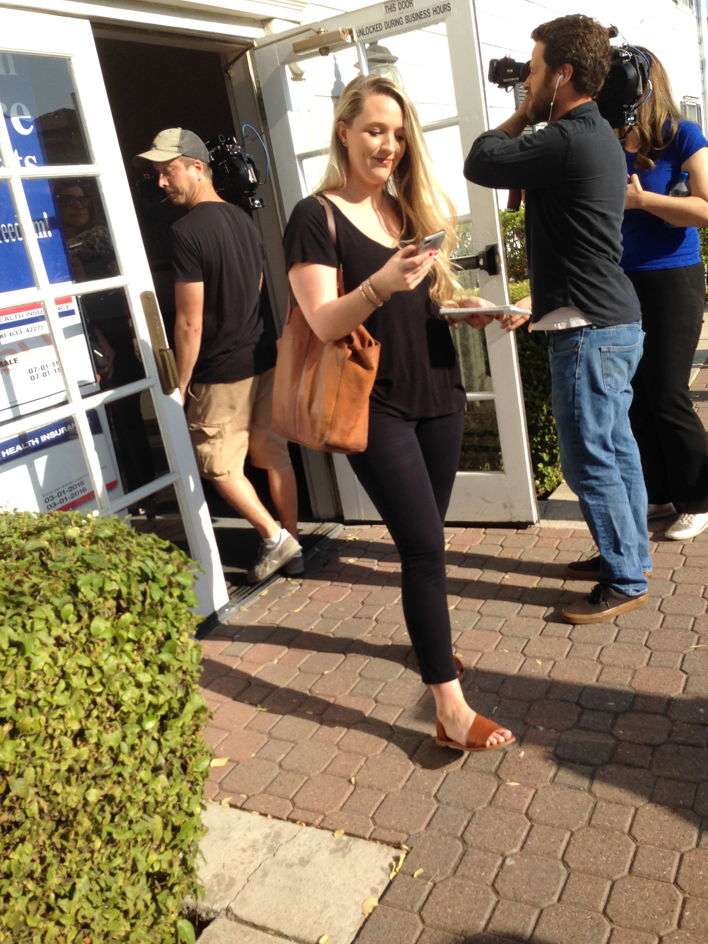 Aug 14 2018. Fresno Bee reporter Mackenzie Mays and videographers from Vice Media covering an EveryTuesday rally in front of Congressman Devin Nunes’ unoccupied regional office, Clovis CA