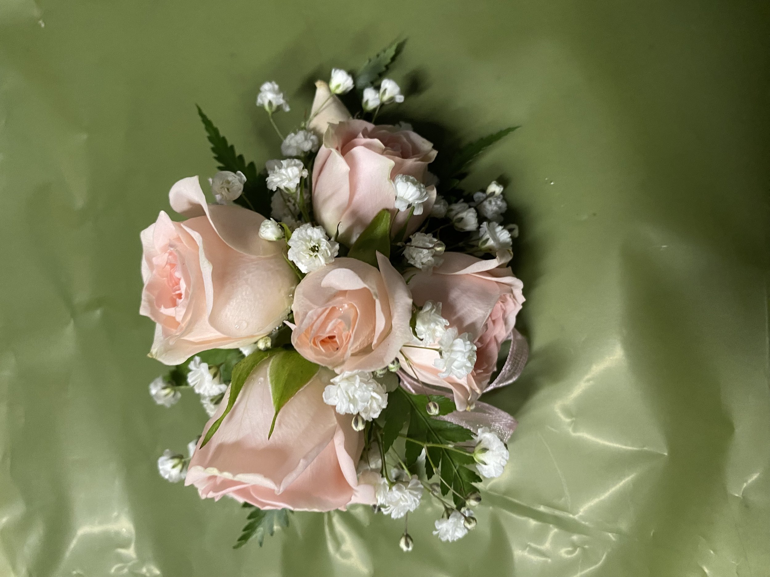 • Pink Roses: "Soft pink fresh rose corsage with gyp, and ribbon – handcrafted at Lilypilly South Perth
