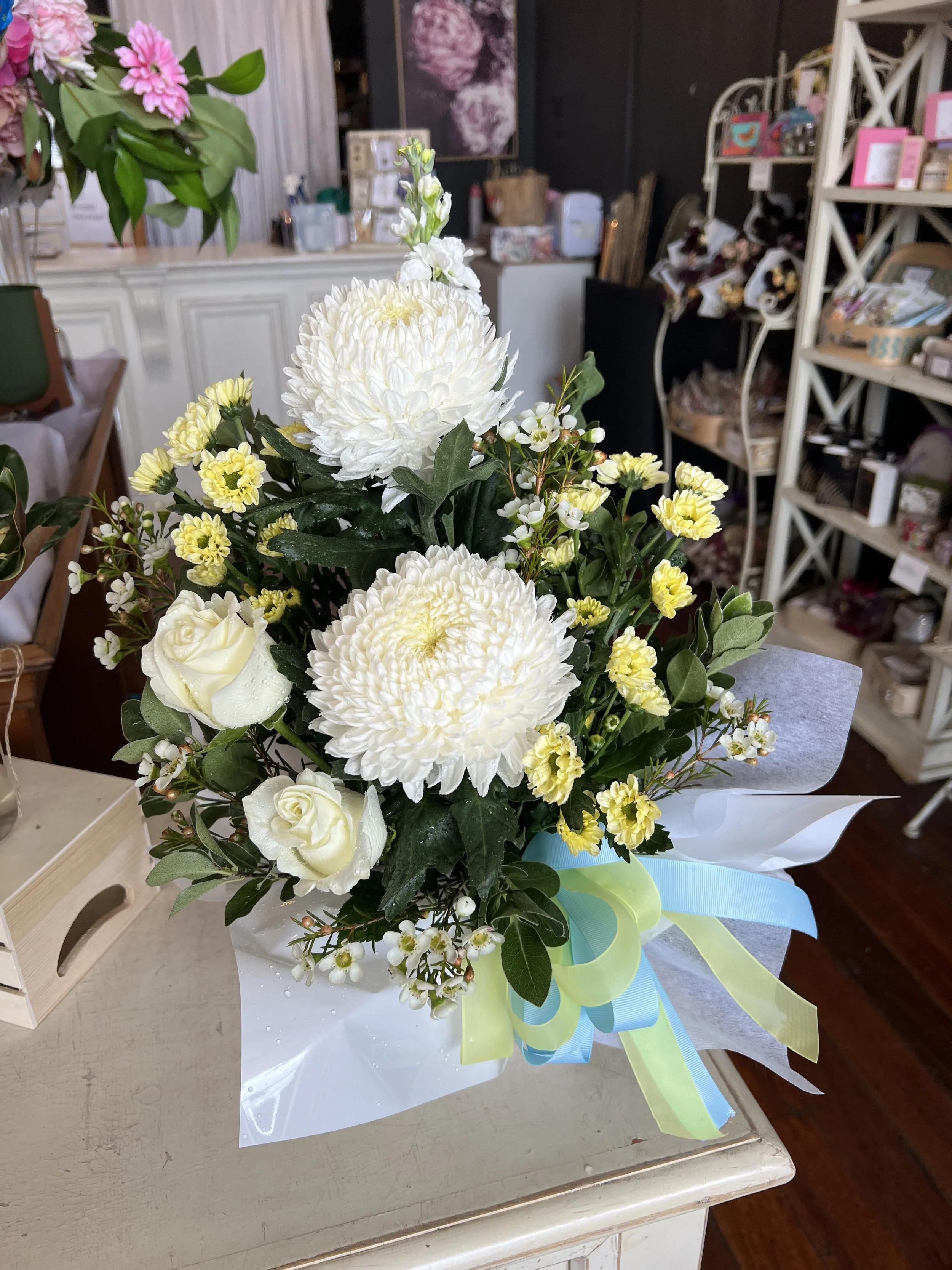 fresh flower box arrangement in whites and lemons with pale blue bow