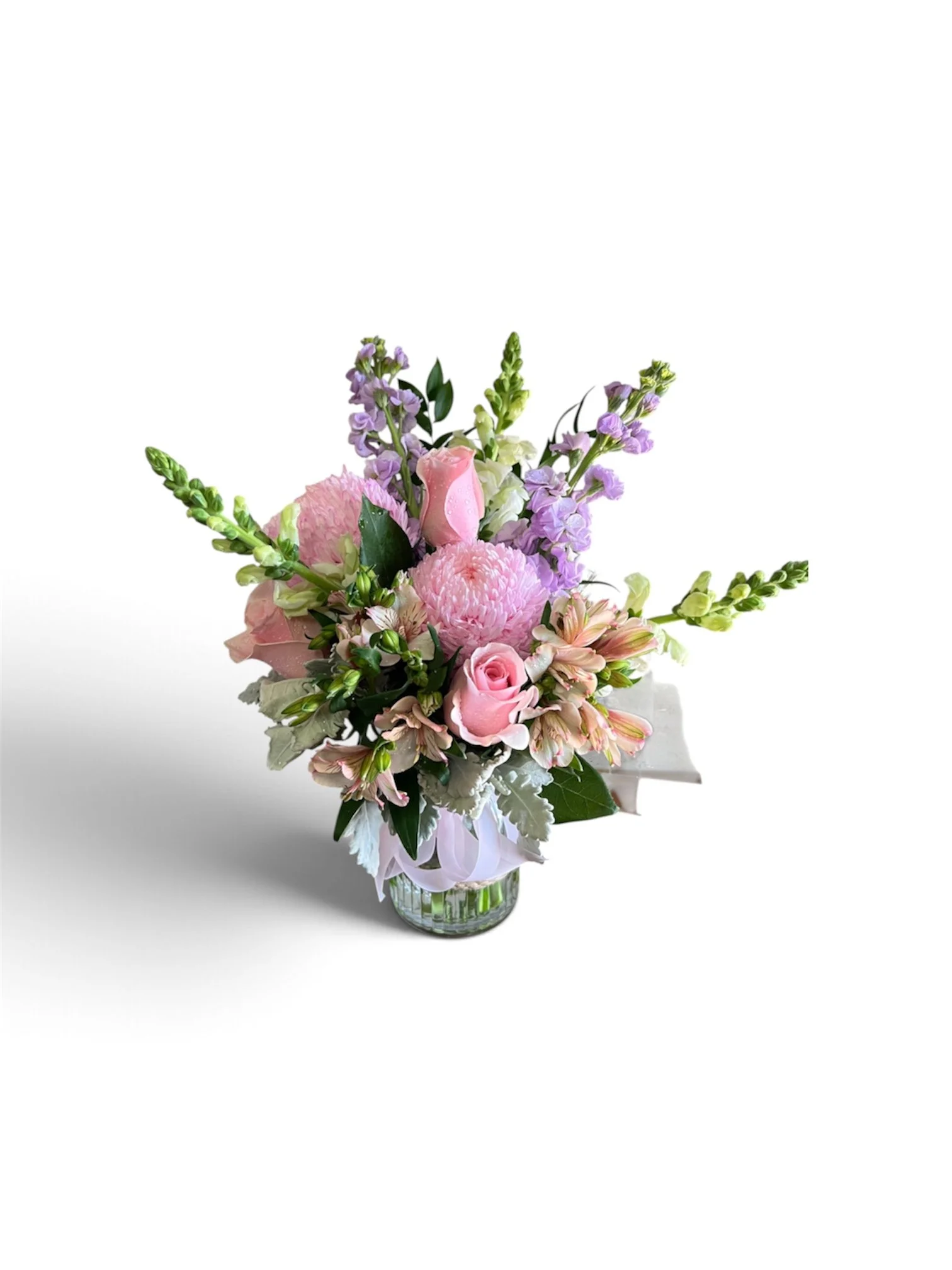 Send a deluxe seasonal flower arrangement in a hurricane glass vase from Lilypilly Florist & Gifts in South Perth. Fresh flowers, handcrafted with care, with Perth delivery available.