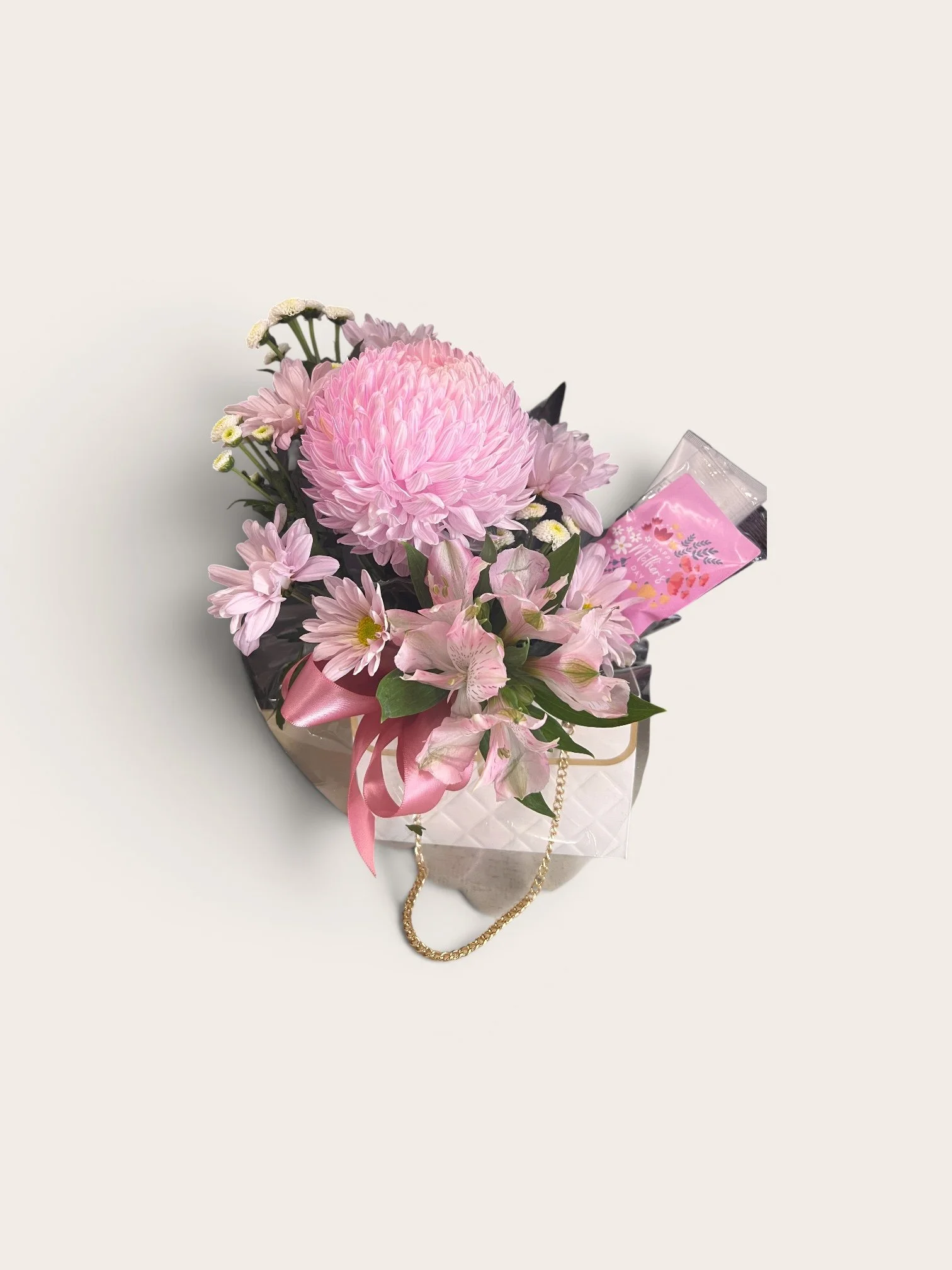 Mum’s floral handbag gift set with fresh flowers hand cream and rock candy Perth florist Mother’s Day gift