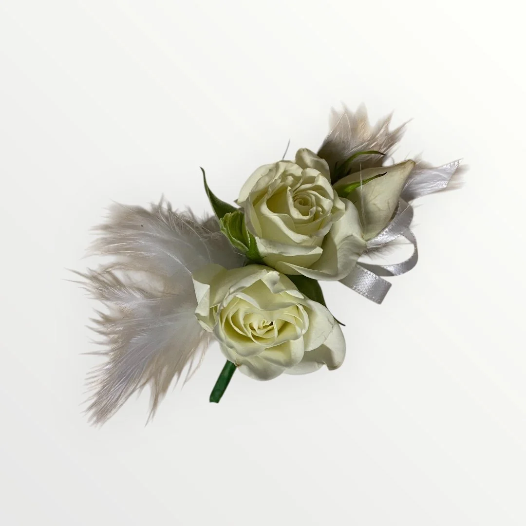 "Vintage-inspired Gatsby buttonhole with fresh rose and feathers – elegant floral design from Lilypilly South Perth."