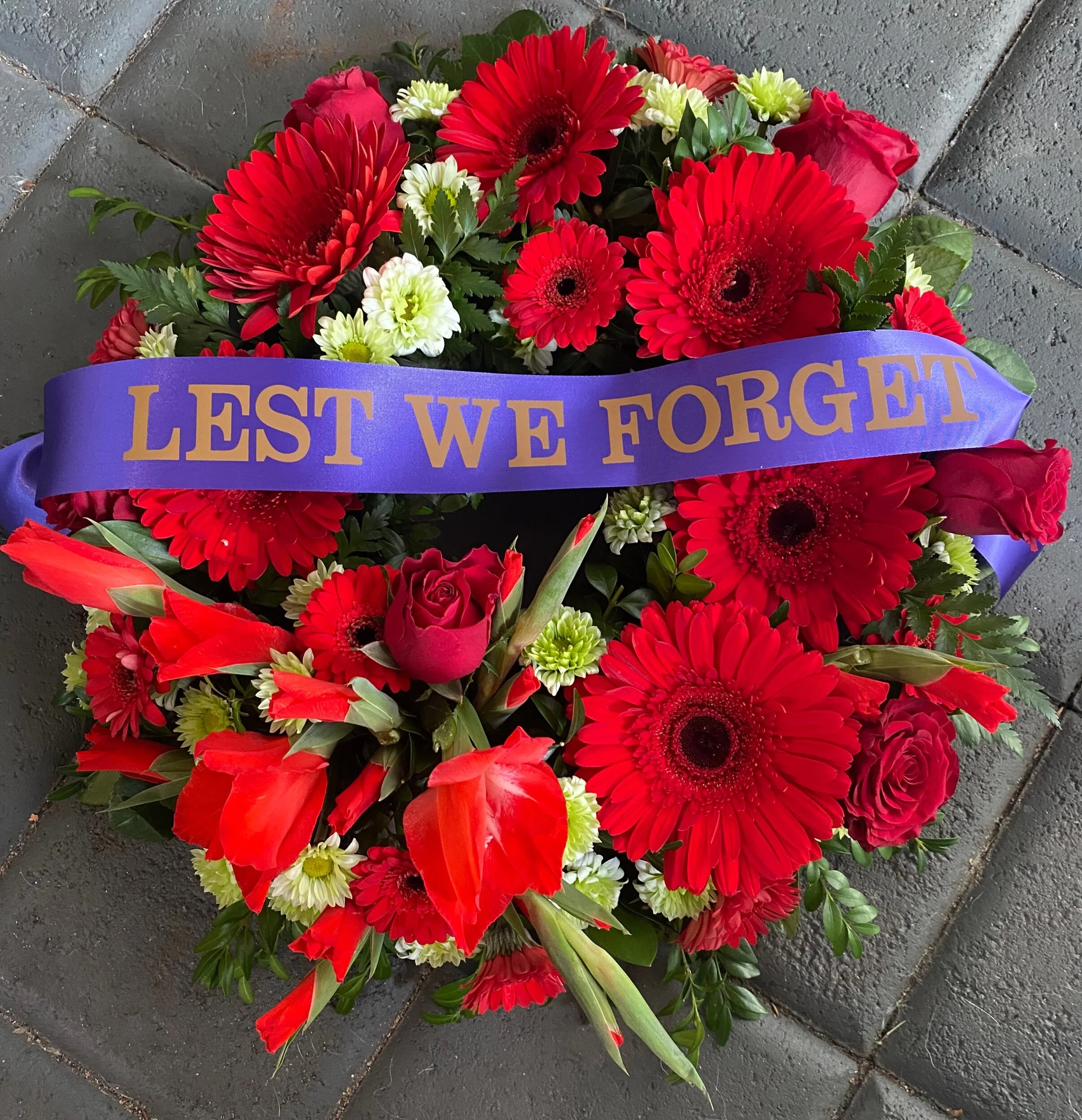 red wreath with ribbon