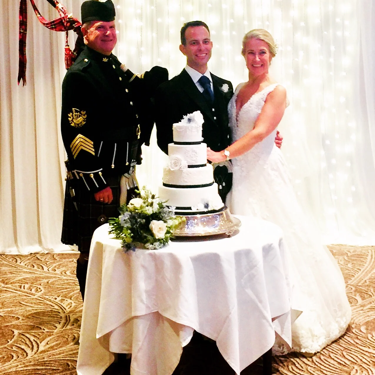 Mr and Mrs Bremner cutting the cake