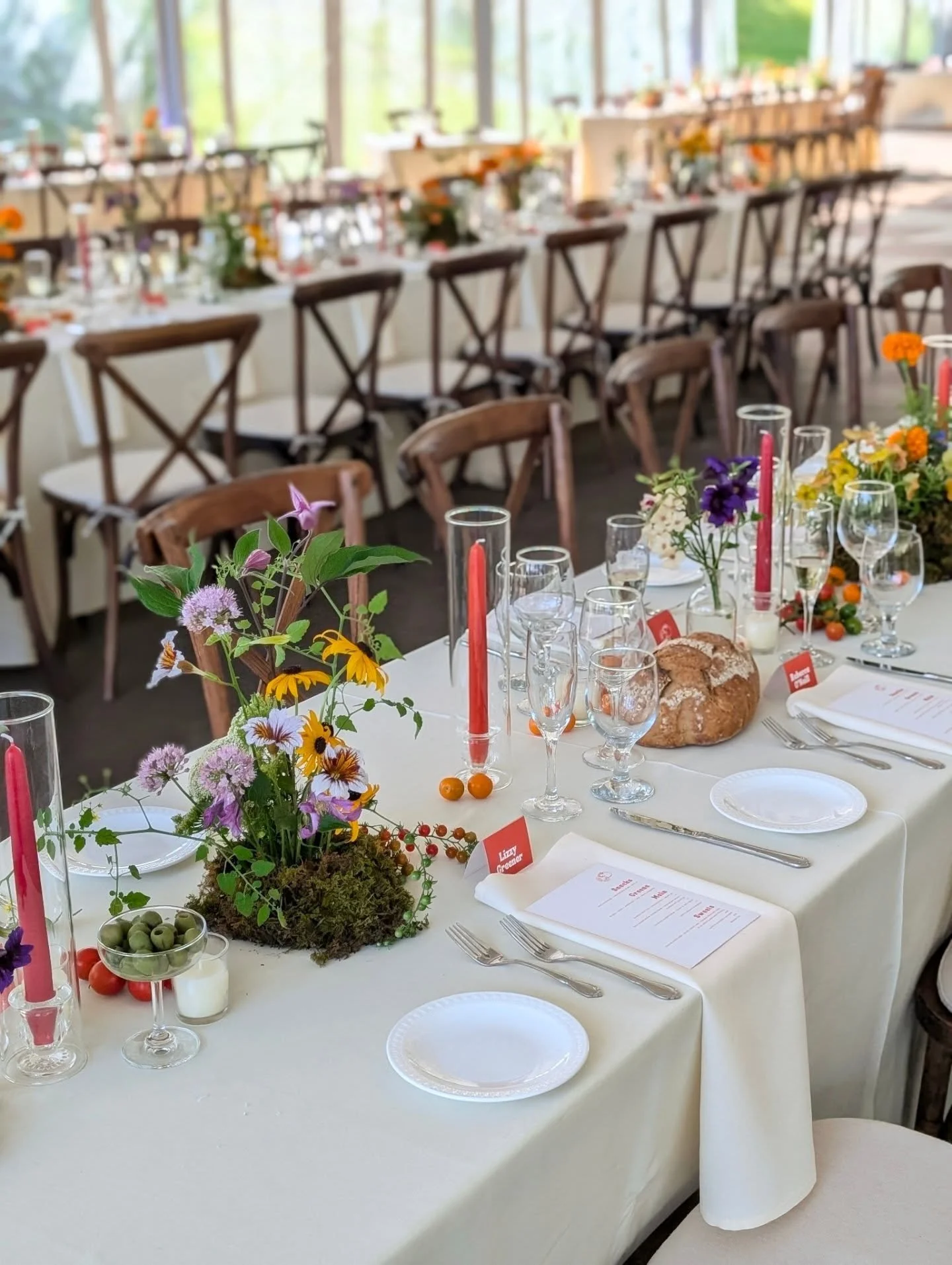 This table scape! For Maggie and Marshall's fun, colorful wedding this past weekend at Farm Road Estate. It's not just about the flowers sometimes. Red and orange taper candles, olives in glass coupes, freshly baked bread, a variety of locally grown 
