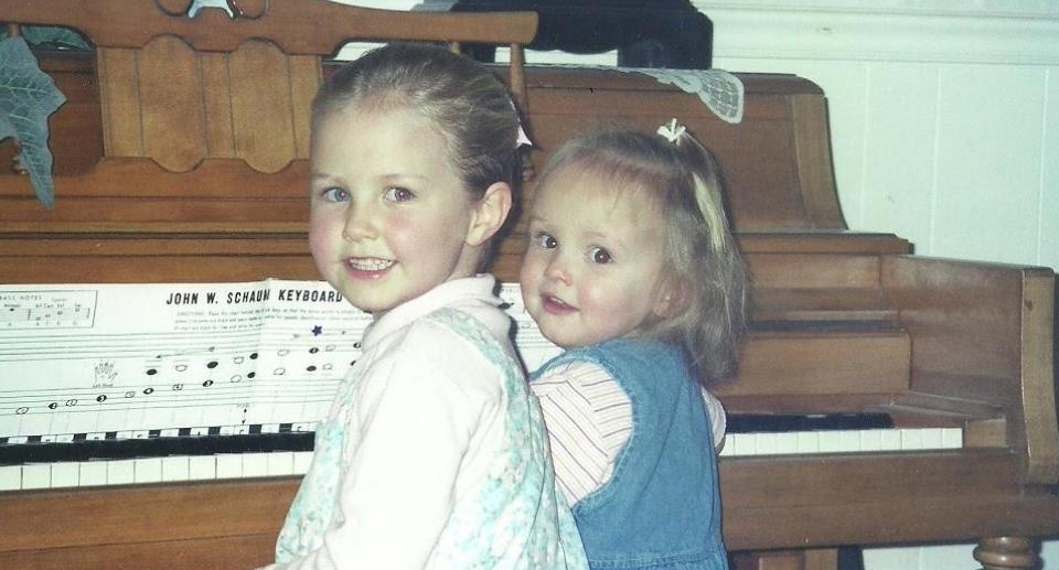 Five-year-old me at the piano with my little sister, Nikki!