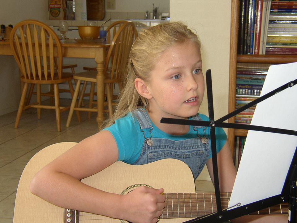 My first guitar! Baby Martin. Please note the sparkles on my face... :)