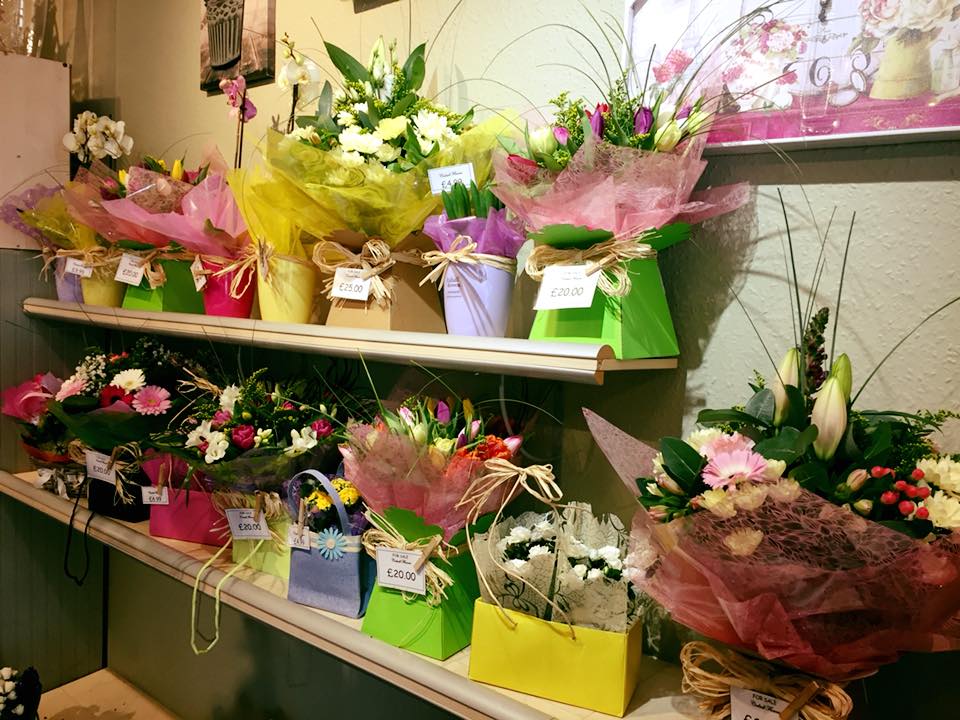 Colourful Flower Gift Boxes on Shelves