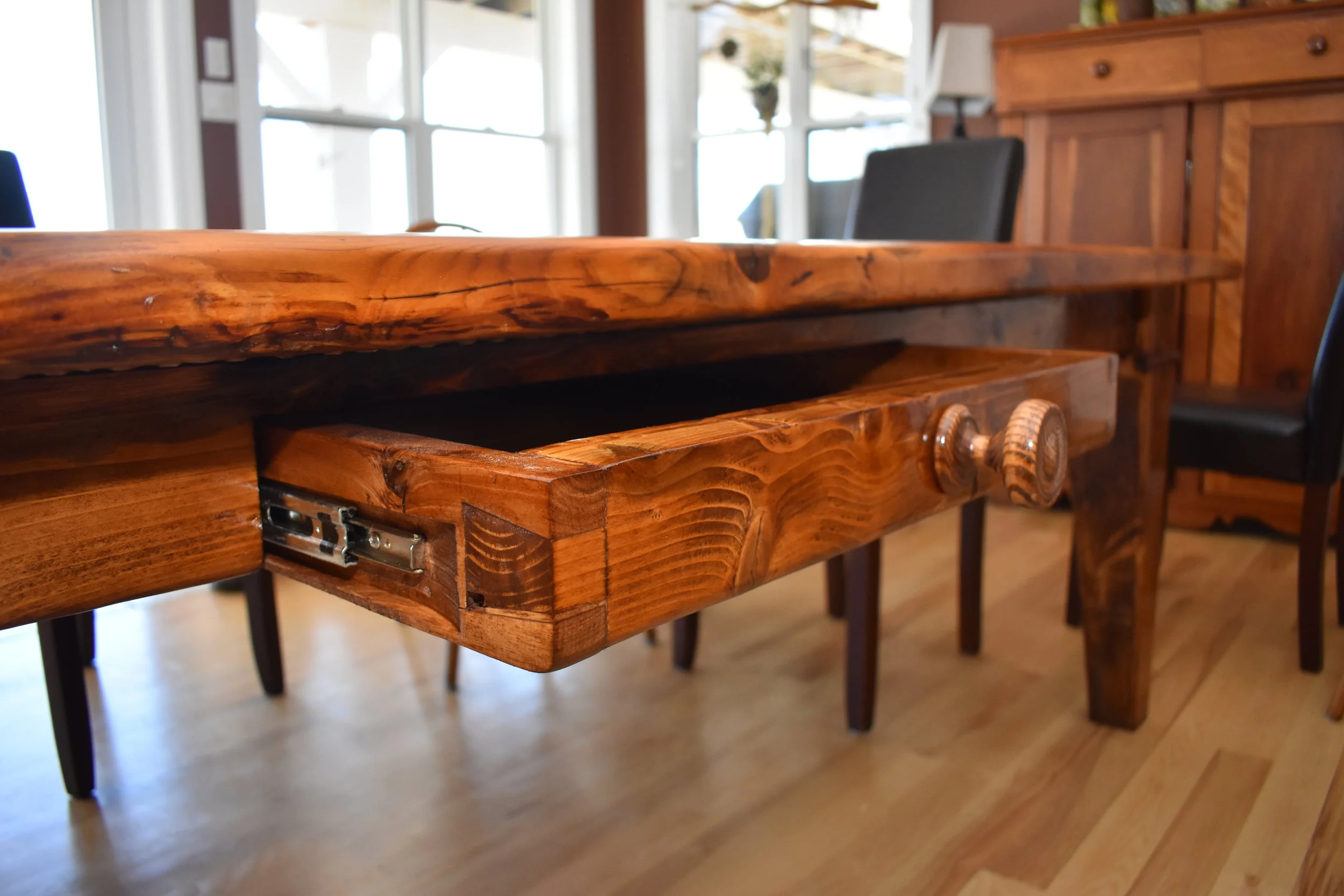  Hand chiseled drawer with custom ash knob spun on the lathe. Drawer is wide enough to hold the table place settings. 