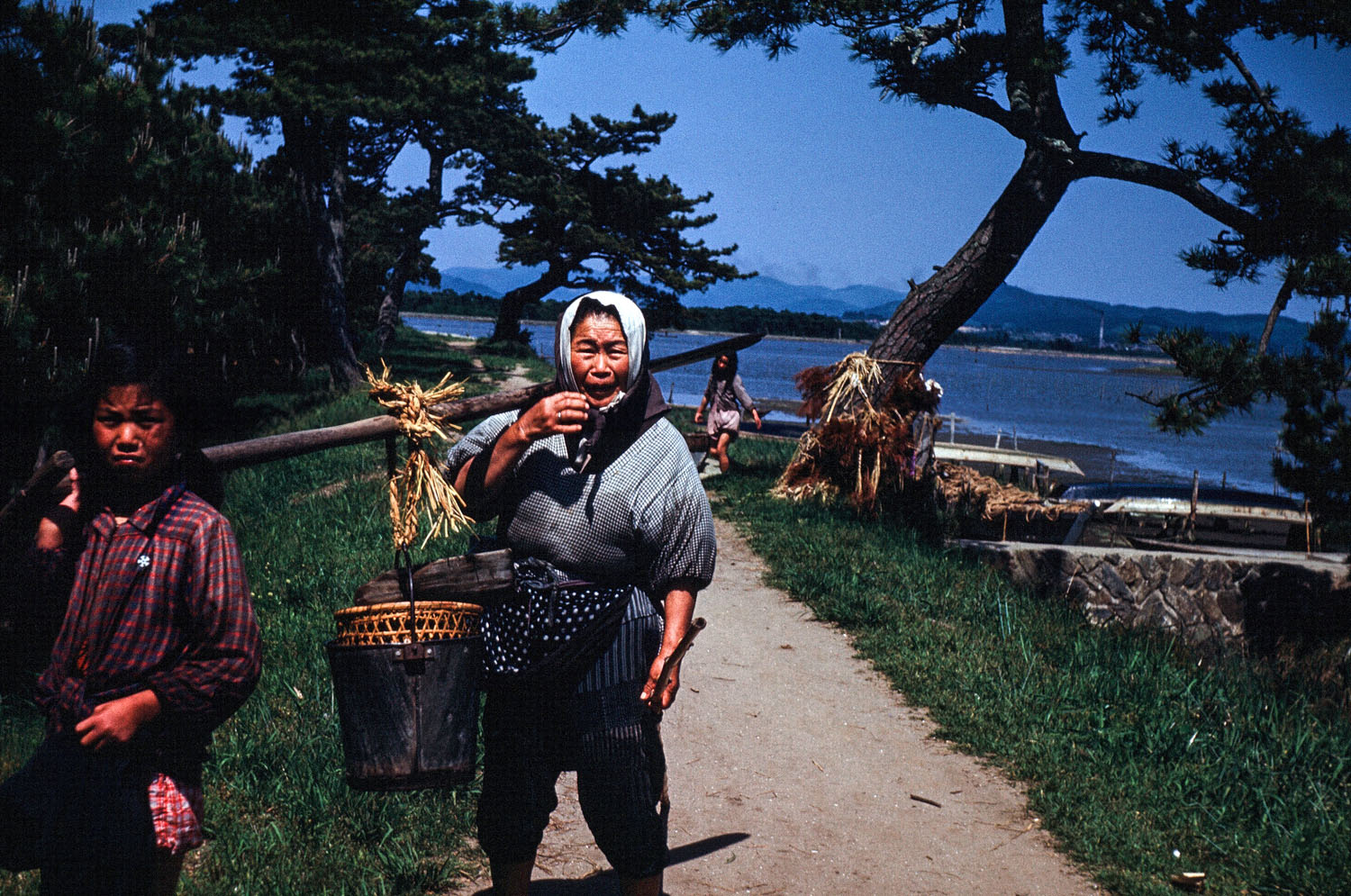 39a - Woman with Load, Coming from the Bay