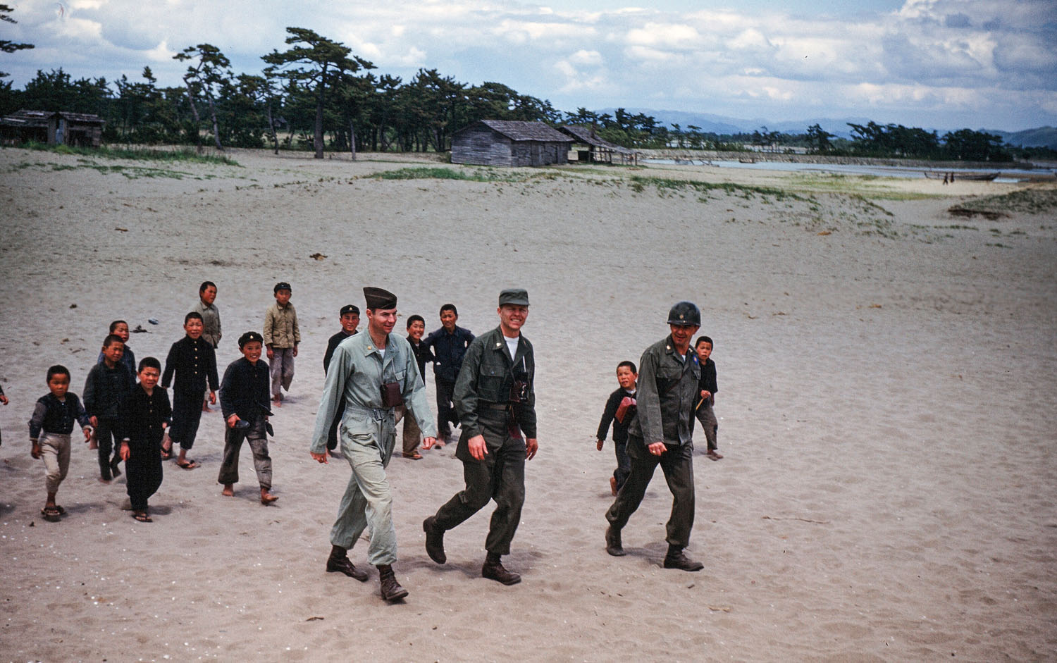 56- American Soldiers Being Followed by Children