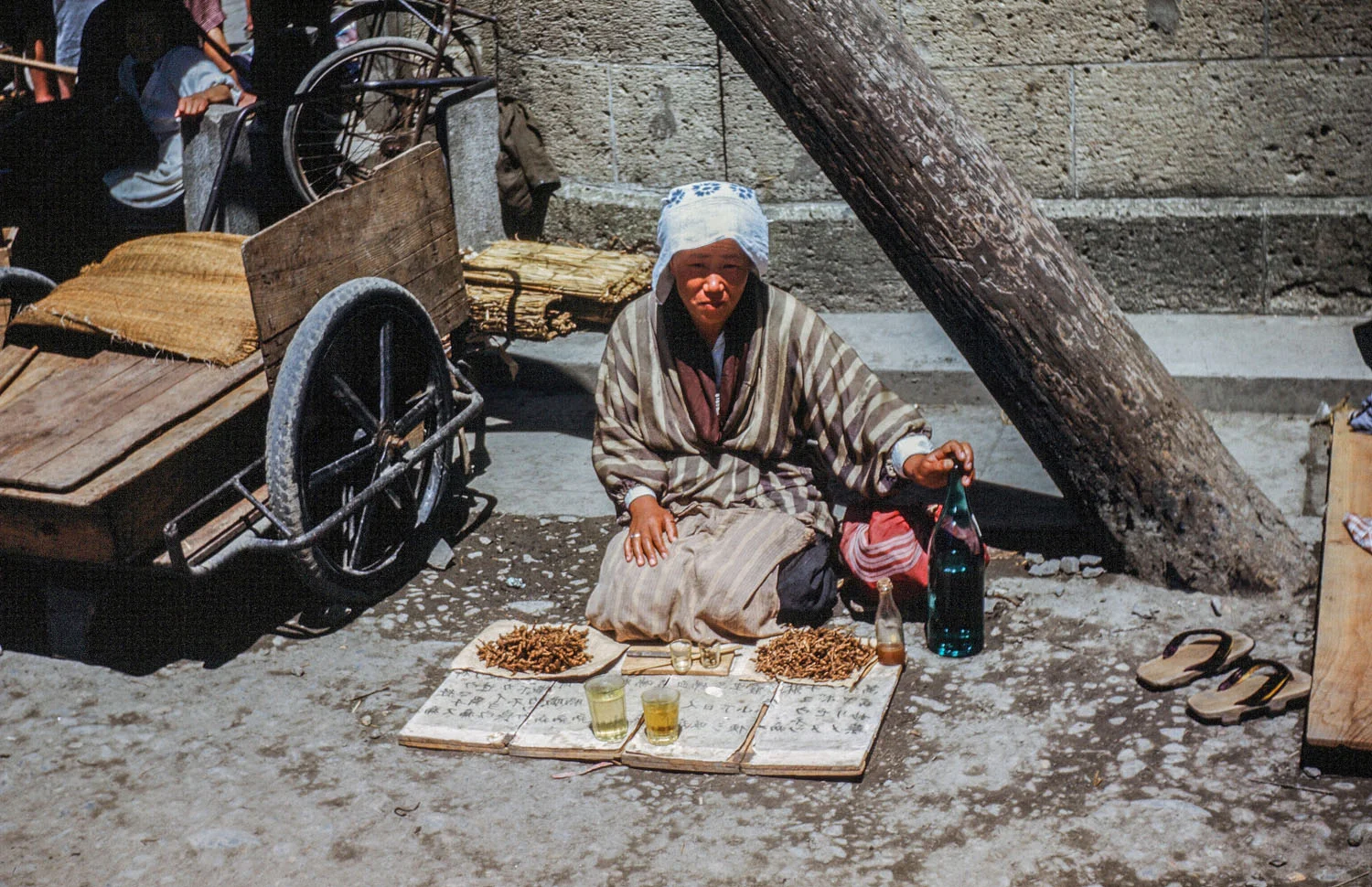 357-Woman Selling ? on Street