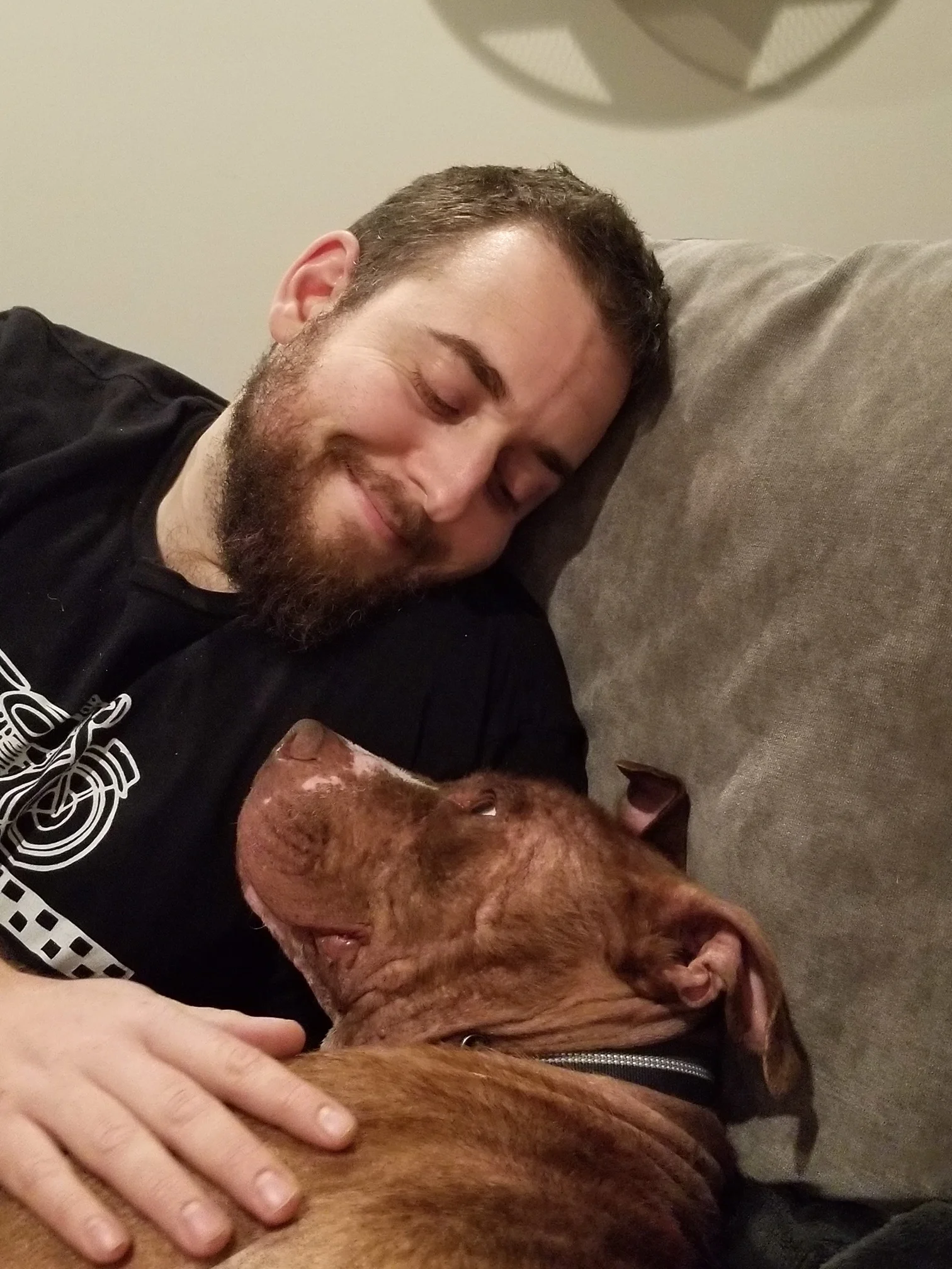Franklin snuggles up at home with his new dad, Nick.