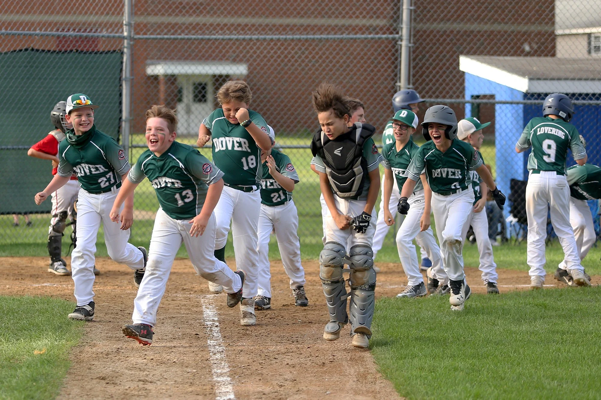 The Dover 10-year-old summer team celebrates after Owen Lovering hit a game tying, two home-run to right field in the bottom of the fifth inning July 12, 2021.
