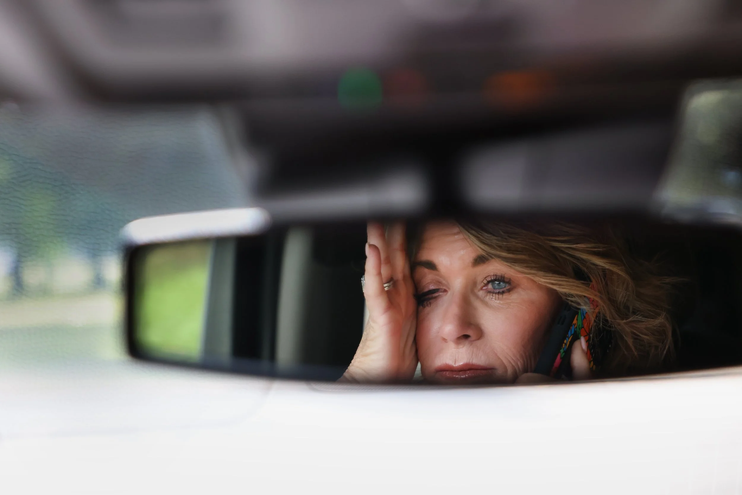 Malinda Harris wipes away tears on Wednesday, Sept. 25, 2024 in Kennett, Mo., as she makes a phone call to her family on her way to pick up Alyssa's  belongings from CPS.