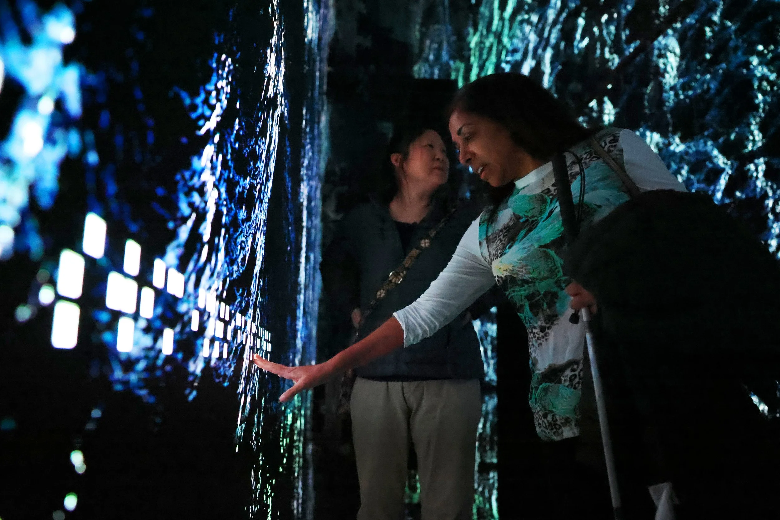 From left, Lighthouse Guild’s assistive technology specialist Cheryl Chung and Nisha Falcigno visit an immersive gallery with braille at The Mercer Labs on Jan. 27, 2024 in Manhattan, NY. 