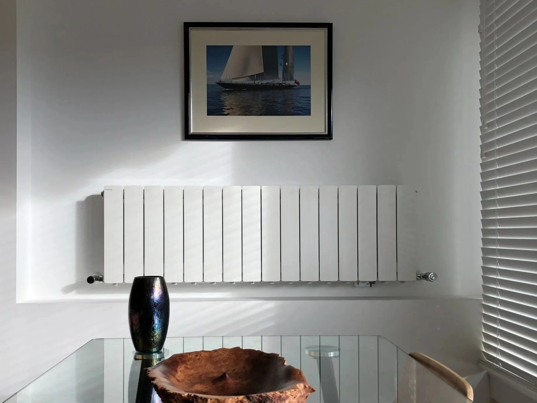 empty room with hardwood floors and wall mounted radiators